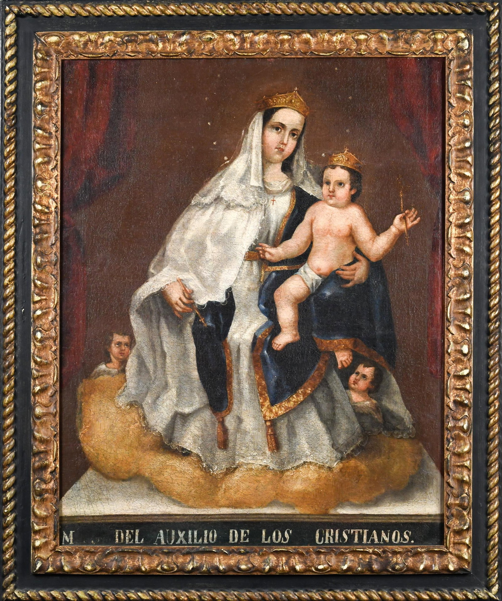 19TH C. SPANISH COLONIAL OIL, MADONNA AND CHILD.: An 18th to 19th C. oil on canvas, Spanish Colonial origin, depicting seated Madonna with infant Jesus, both with crowns holding scepters, two putti at feet. Inscription at bottom reads in
