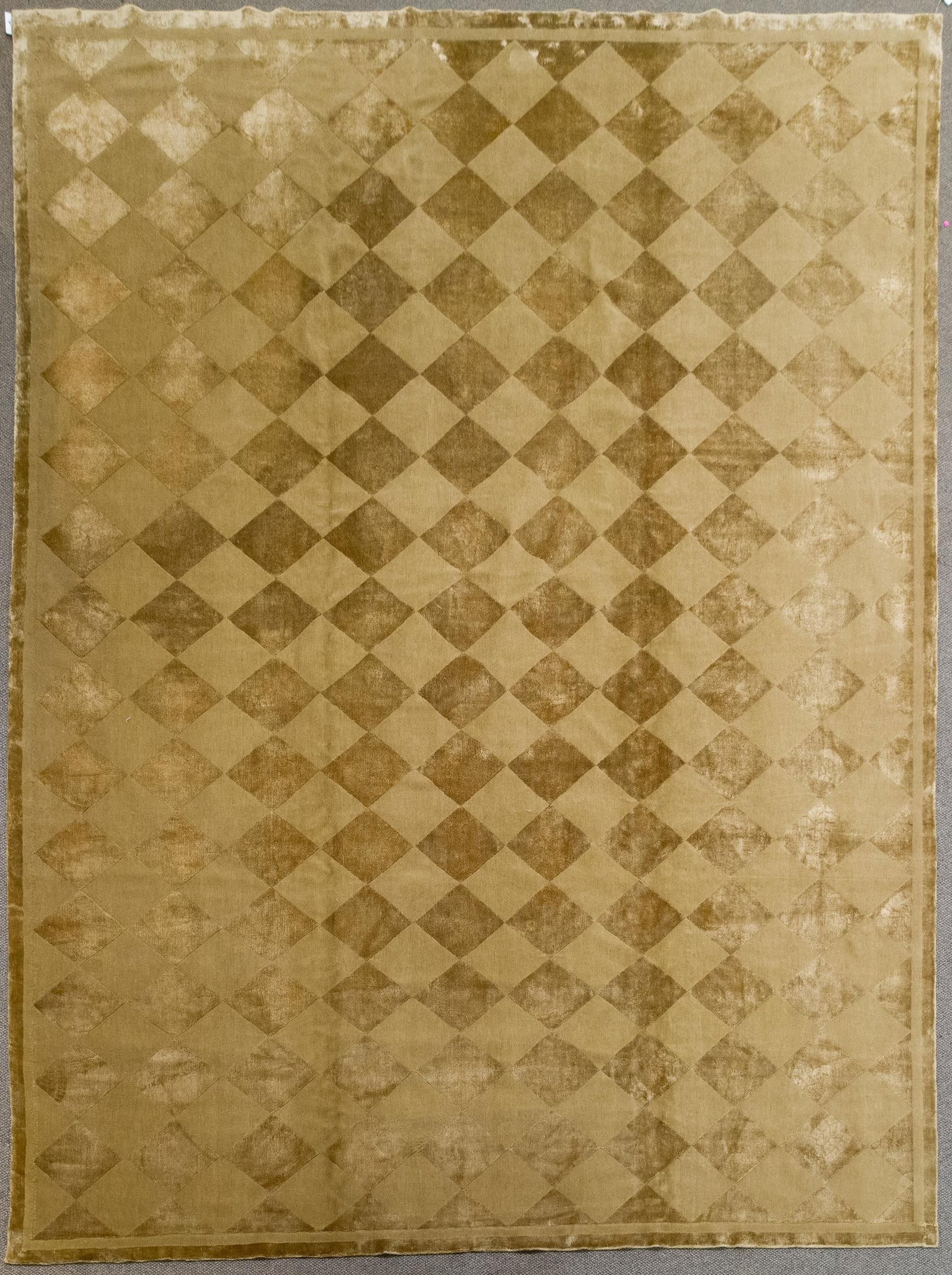 VINTAGE WOOL AND SILK TIBETAN ROOM SIZE RUG.: A vintage hand woven Oriental Tibetan room size silk and wool monochromatic rug.9'4” x 12'6”.