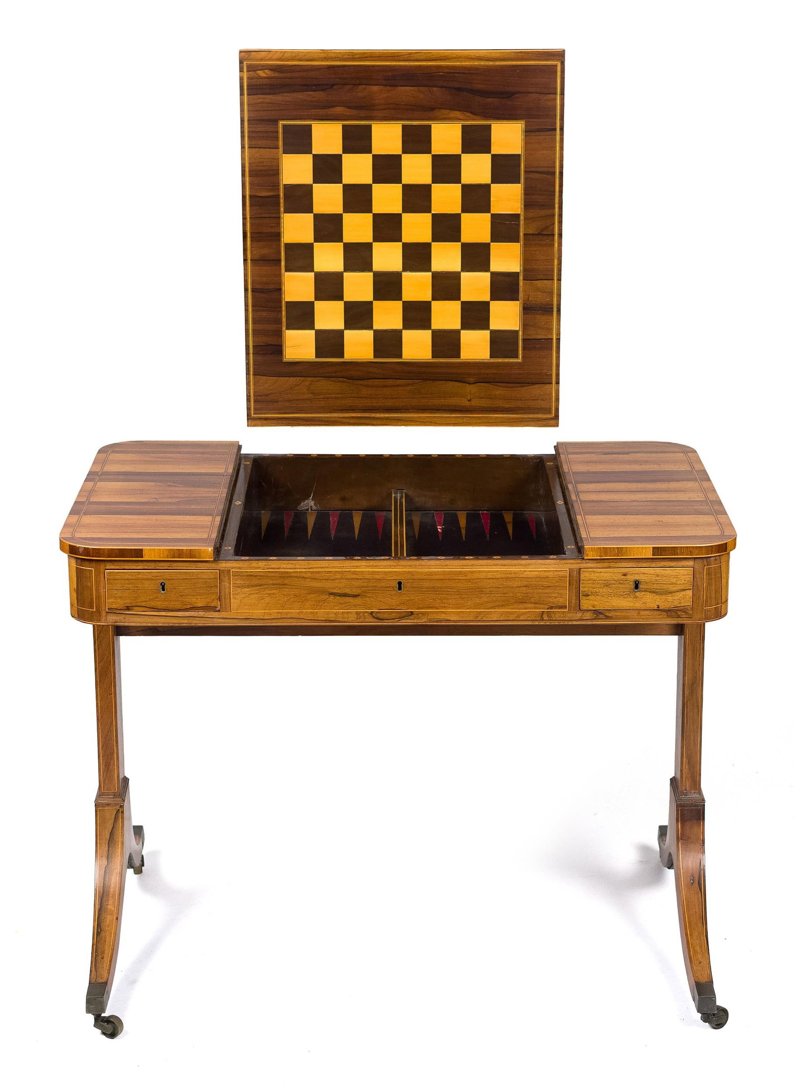 FINE ENGLISH REGENCY ROSEWOOD GAMES TABLE.: A 19th C. English Regency rosewood and calamander games table, the top with an inlaid chess board panel, that slides to reveal a painted backgammon well interior, on a trestle base with brass caster f