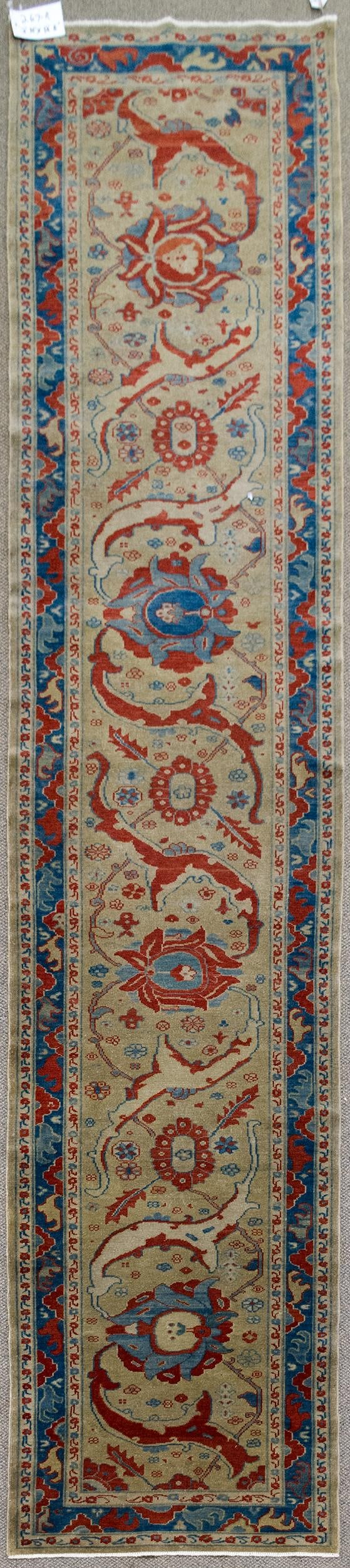VINTAGE ORIENTAL RUNNER RUG.: A vintage hand woven Turkish Oriental runner rug, highlighted with red and blue.2'10” x 12'8”.