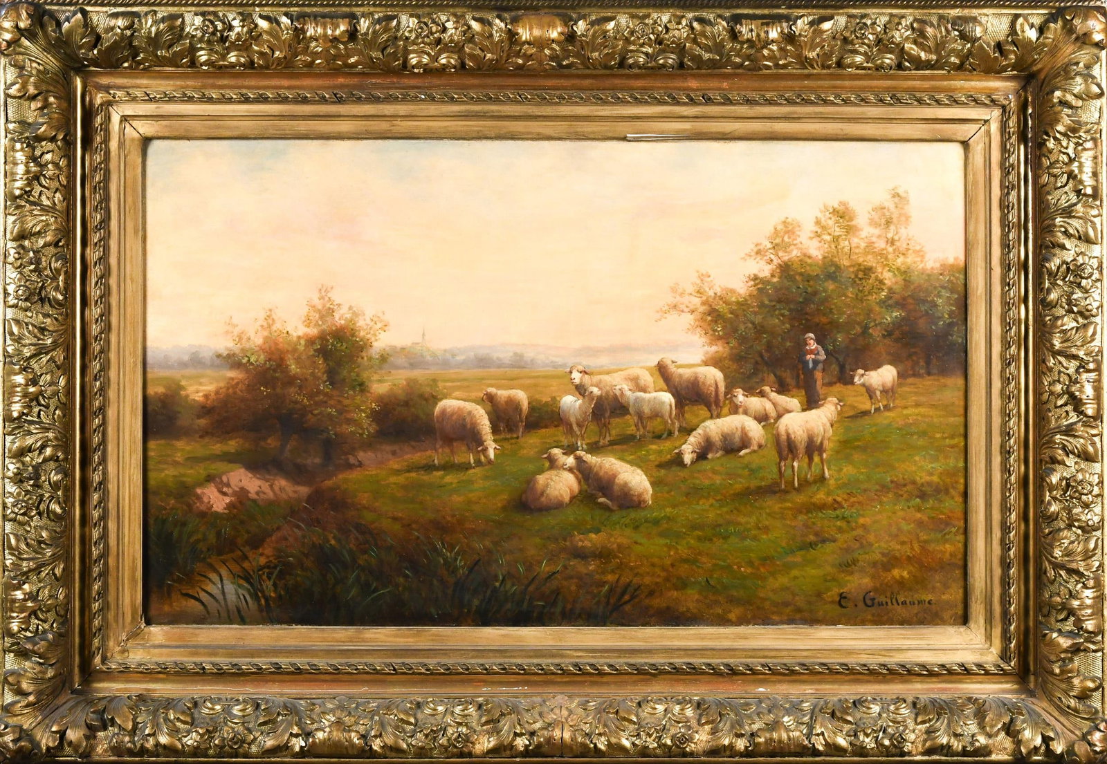 ERNEST ANTONY GUILLAUME OIL, SHEPHERD AND SHEEP.: Attributed Ernest Antony Guillaume (1831-1884) large oil on canvas, shepherd with sheep and village in background, signed lower right, E. Guillaume. Canvas 24.5” x 42”, Frame 38” x 5