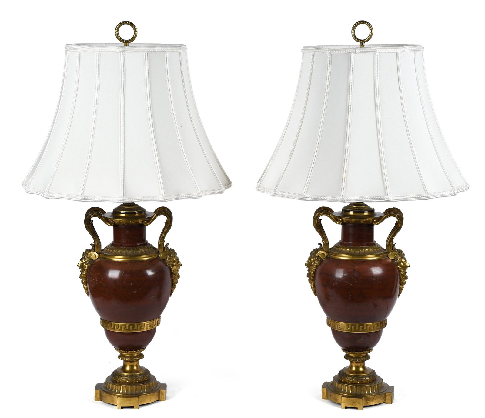 PAIR OF FRENCH BRONZE AND MARBLE LAMPS.: A good pair of antique ormolu mounted French rouge marble table lamps with fabric shades. 24”H overall.