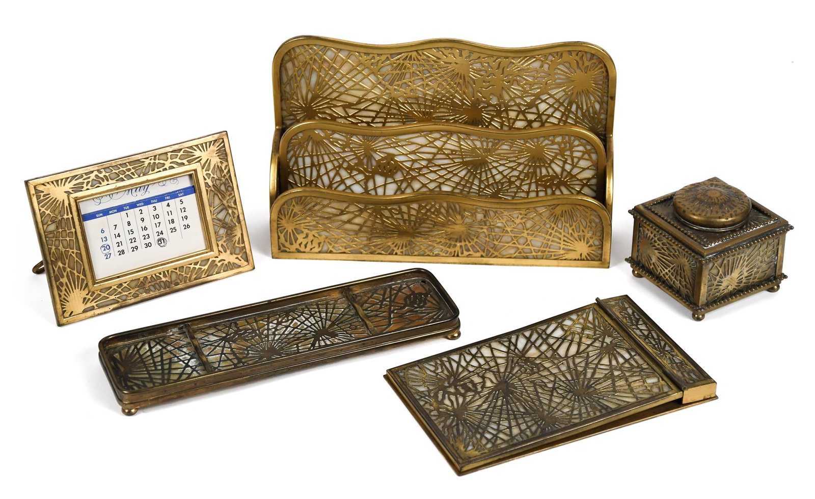 ANTIQUE 5 PIECE TIFFANY STUDIOS DESK SET.: An early 20th C. Tiffany Studios Pine Needle pattern desk set, including: a letter file, 6.25”H x 10”W x 2.5”D; memo pad 75” x 4.5”; pen tray 9.5” x 2.75”; in