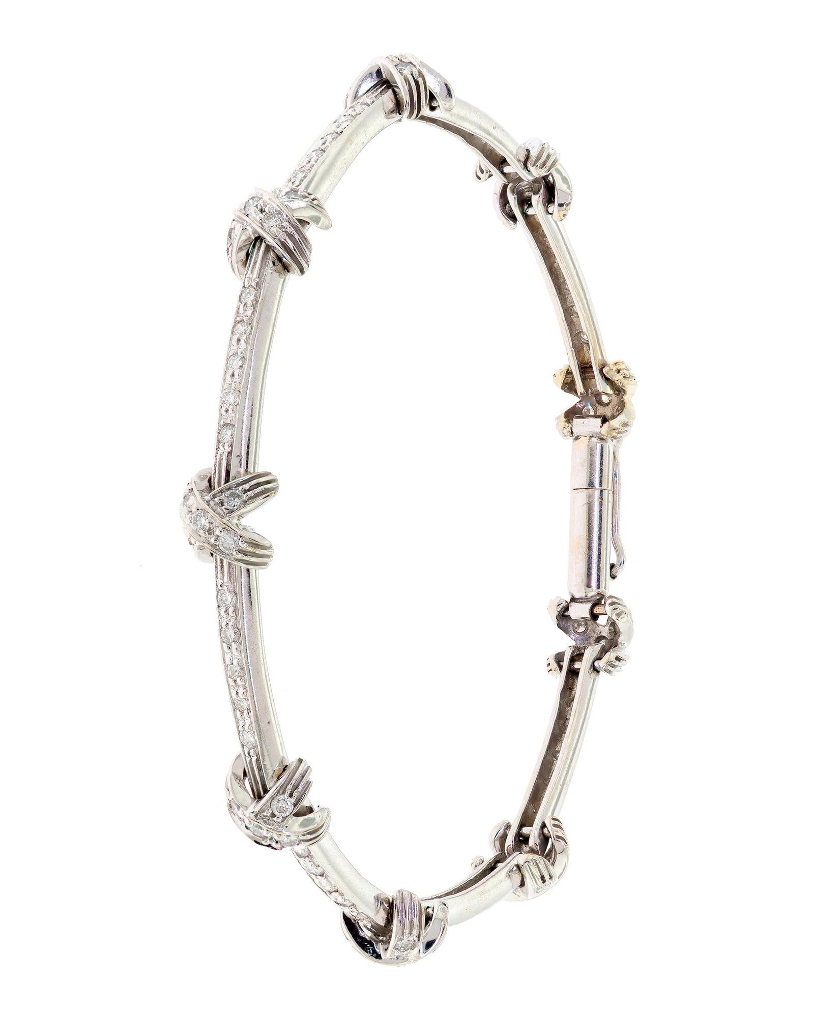 18K WHITE GOLD DIAMOND ”X” LINK BRACELET.: An 18k white gold (stamped) ”X” bracelet set with approx. 1.0 ct. tw., round brilliant cut, natural diamonds of G-H color and VS-SI clarity, 6mm wide, 6 3/8 inches long, 11.7 grams. Tested