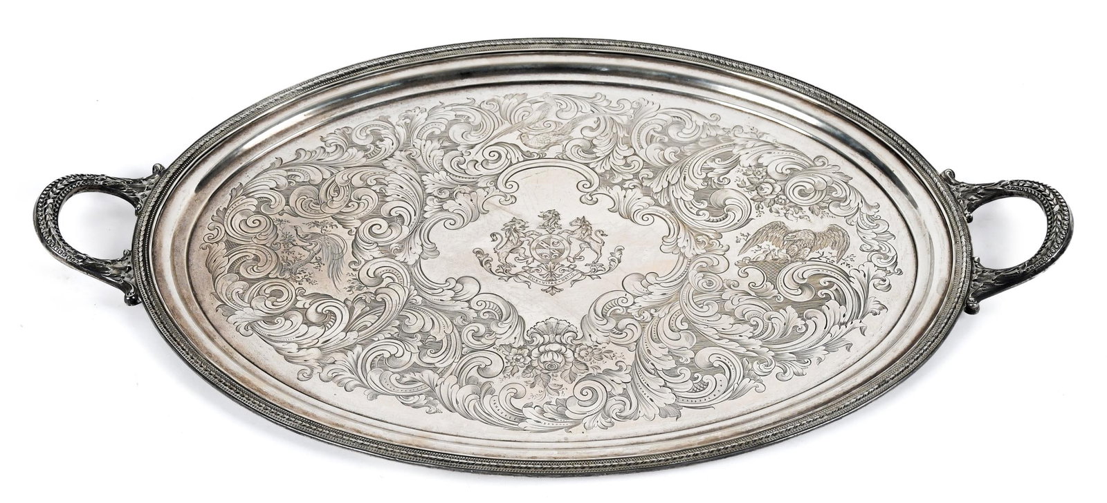19TH C. ENGLISH STERLING SILVER TRAY.: An English sterling silver tray, oval with handles, engraved birds and coat of arms in center. Date mark of 1855, Makers mark BP. 31.5” x 18”, weight 132.5 oz t.