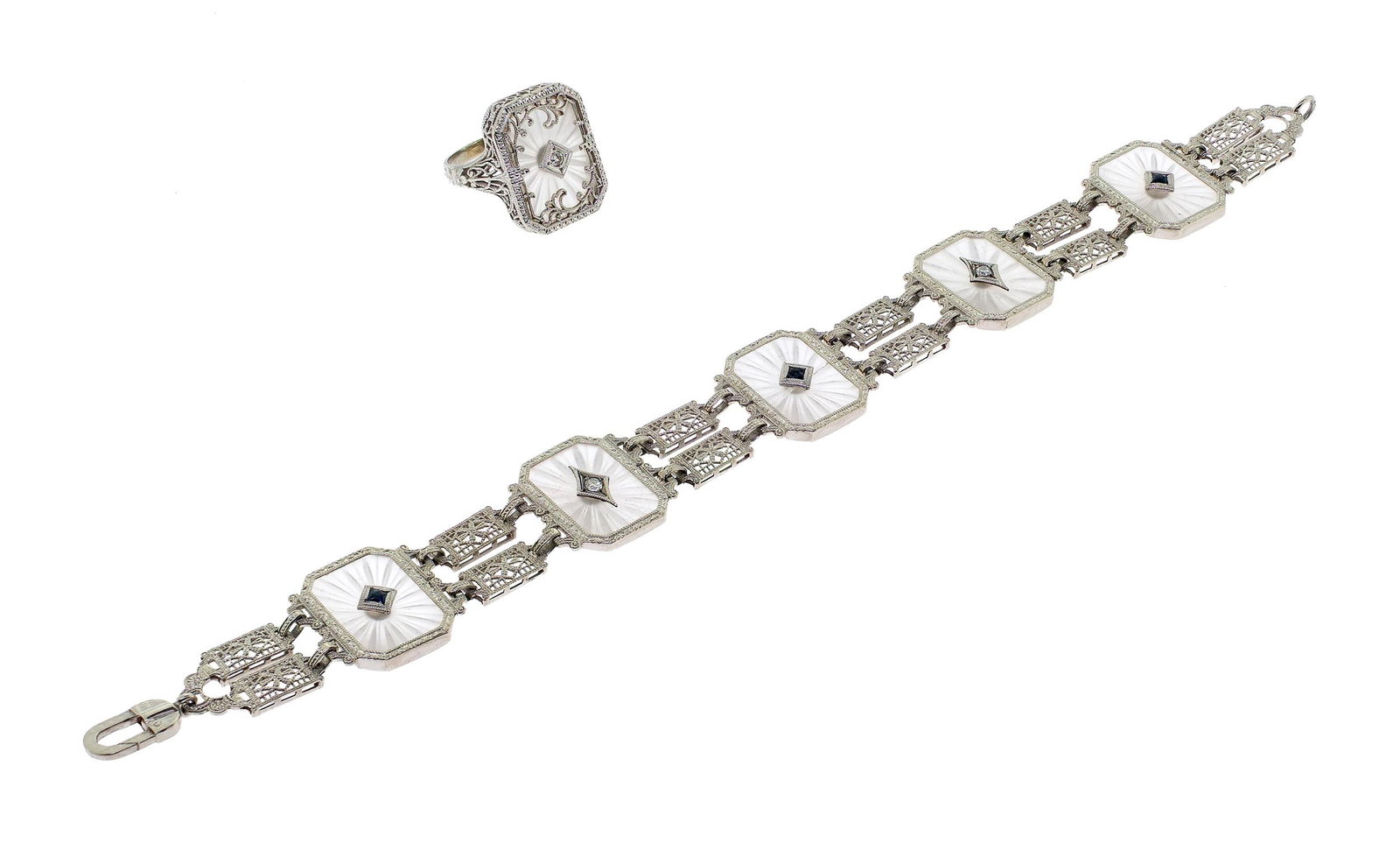 ART DECO 10K GOLD ROCK CRYSTAL BRACELET & RING.: An Art Deco, 10k white gold (stamped) rock crystal bracelet and ring set with approx. .20 ct. tw., round brilliant cut, natural diamonds of H-I color and VS clarity and square cut, dark blue sapphires