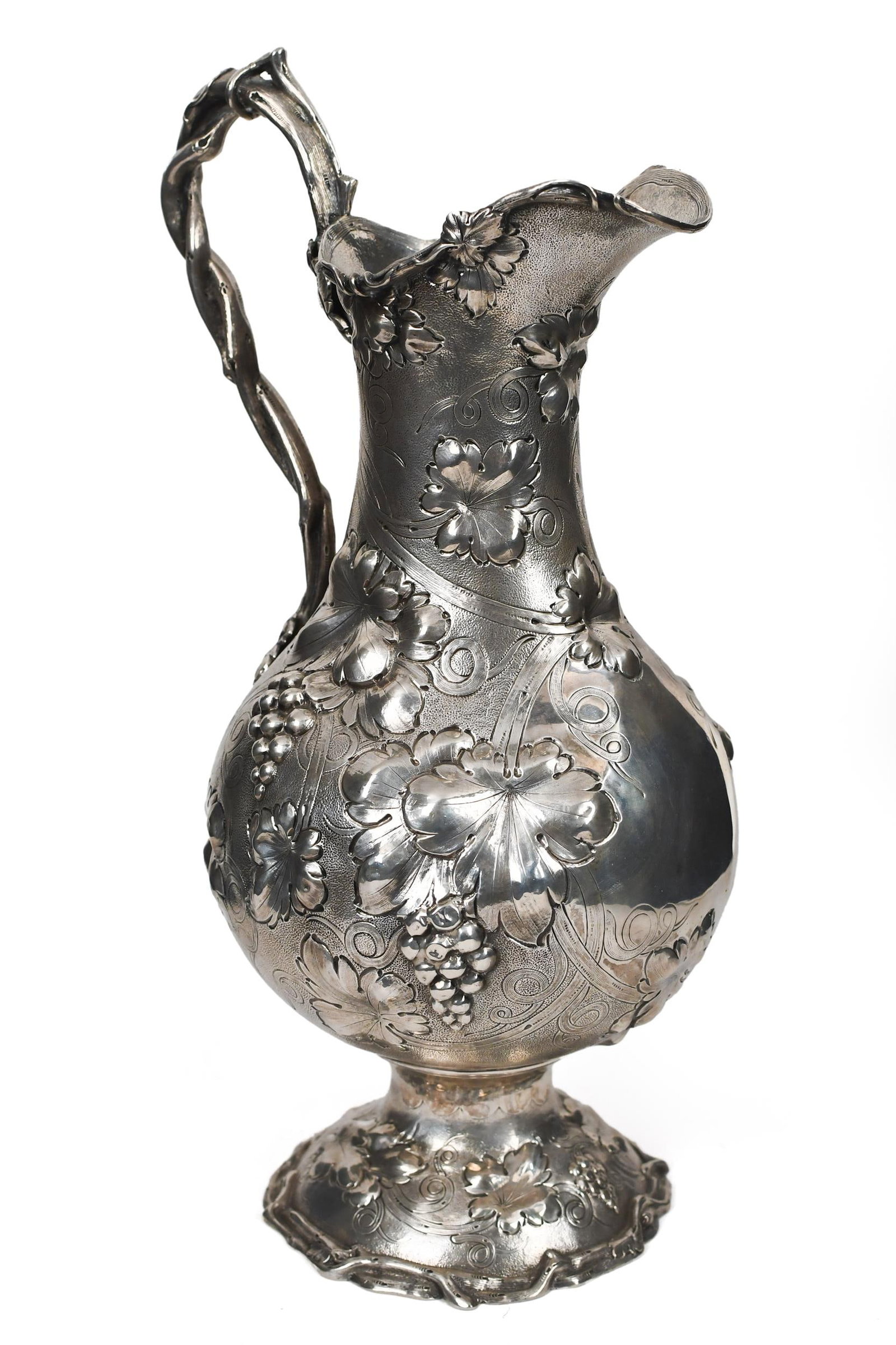 19TH C. CHARTERS, CANN & DUNN COIN SILVER PITCHER.: A mid-19th C. Charters, Cann & Dunn, New York, coin silver pitcher, with grape vine motif repousse and chased decoration, with interwoven vine handle. Stamped on bottom, Ball, Black & Co., CC&D, NY. 1