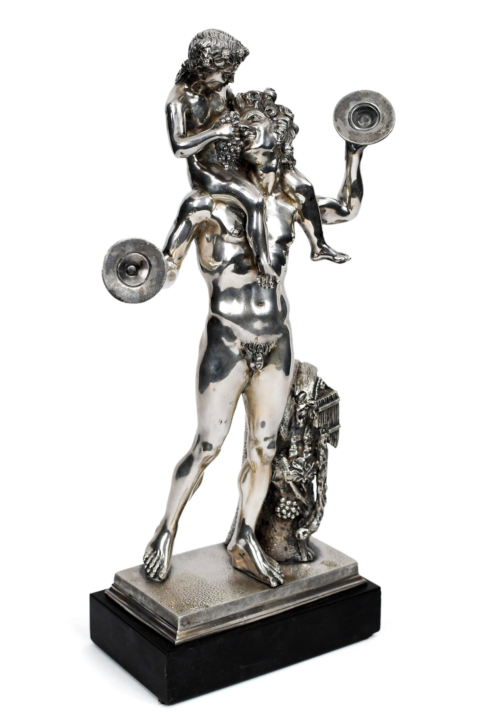ITALIAN 800 SILVER SCULPTURE, SATYR AND BACCHUS.: An Italian 800 silver sculpture of satyr and young Bacchus feeding him grapes. On black metal base. Signed on reverse Martinez, stamped 800. 14”H. Total weight including base 113 oz t.