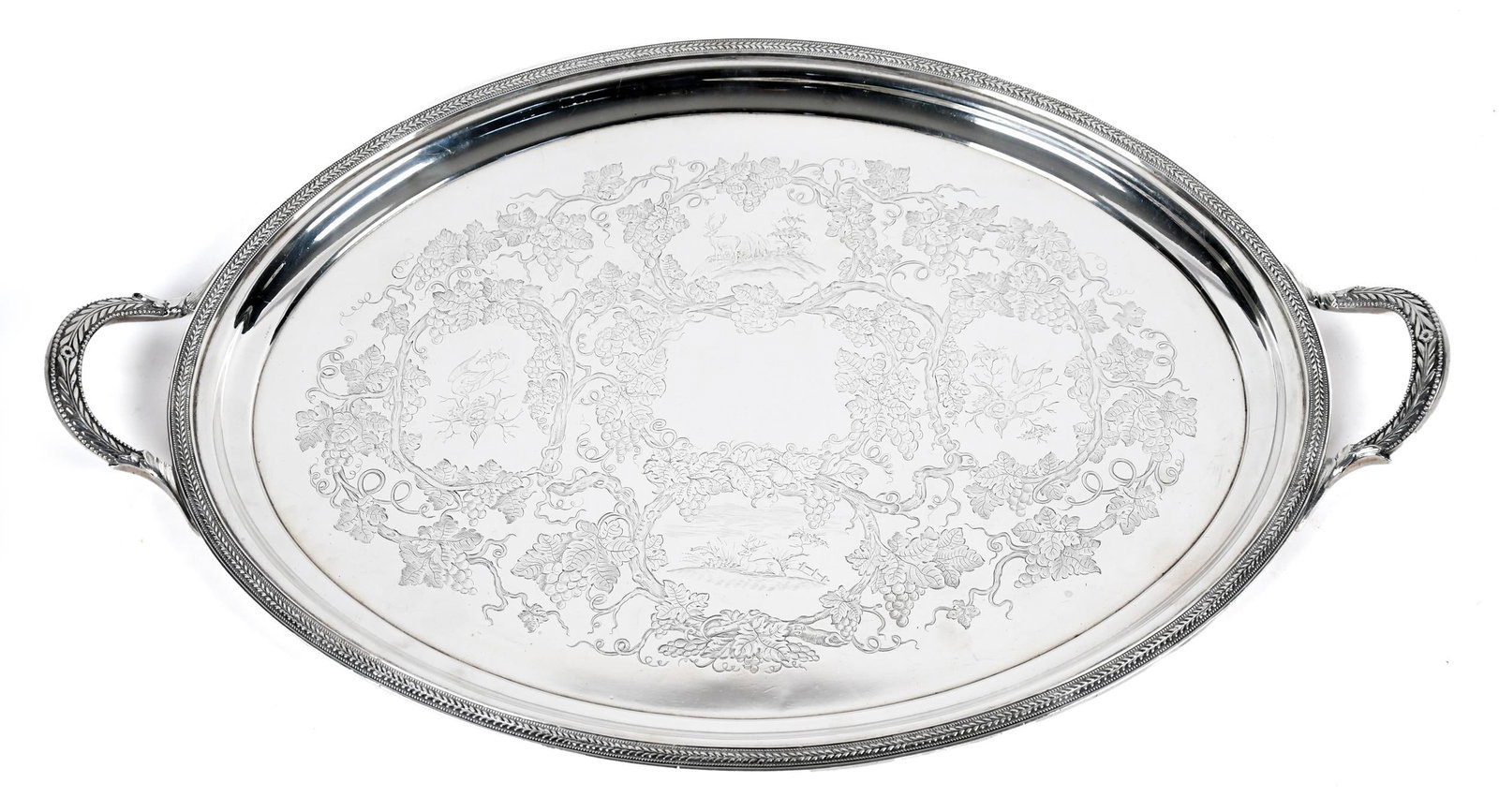 WILLIAM FORBES BALL, BLACK & CO. COIN SILVER TRAY.: An 1850s William Forbes, Ball, Black & Co. New York, coin silver oval tray with handles, chased decoration of birds and stags. 26”L x 16.5”W. Weight 91.8 oz t.