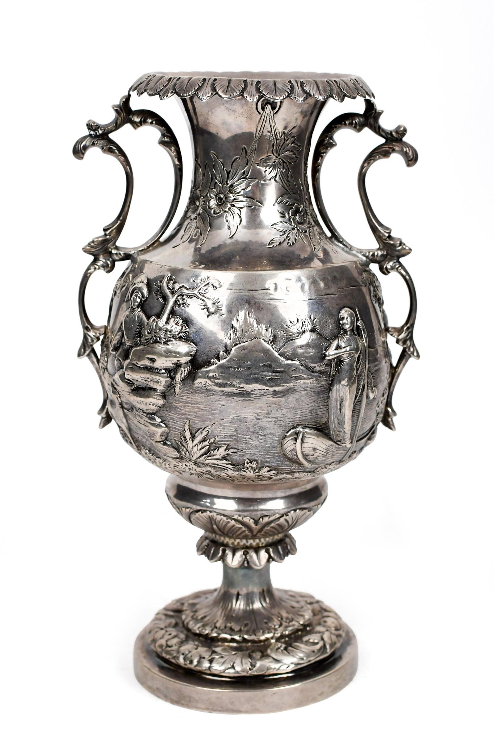ROBERT & WILLIAM WILSON COIN SILVER URN.: A mid-19th C. Robert & William Wilson coin silver urn, with repousse decoration of man with dog and woman in boat. Stamped on underside R& W.W. Engraved in inside of lip “June 3 1889, We. M.R