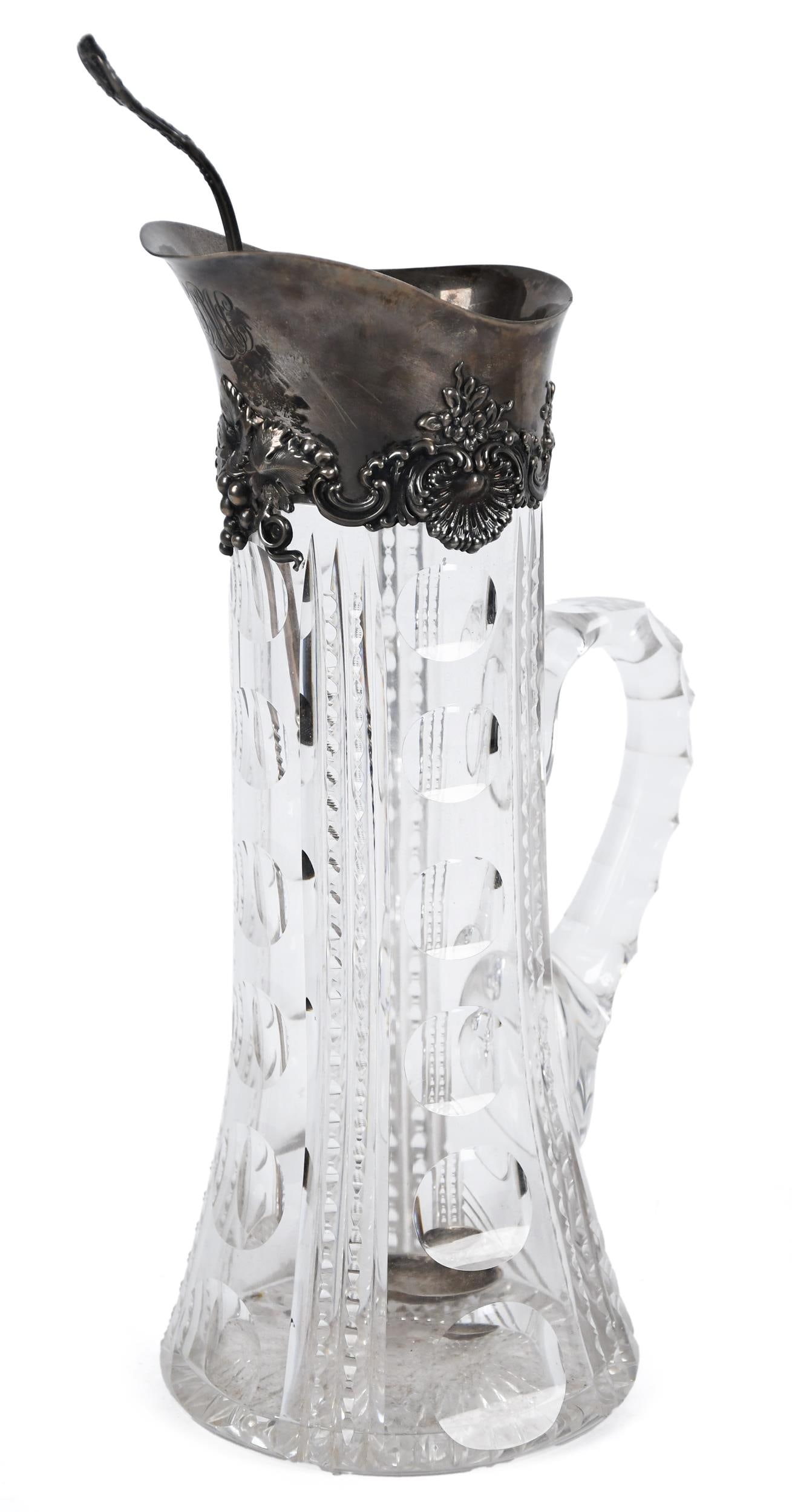 TIFFANY & CO. STERLING AND CUT CRYSTAL PITCHER.: A Tiffany & Co. cut crystal pitcher with sterling silver rim with grape, shell and floral decoration, monogrammed ECM, stamped Tiffany & Co Maker, Sterling Silver. With original matching sterling silv
