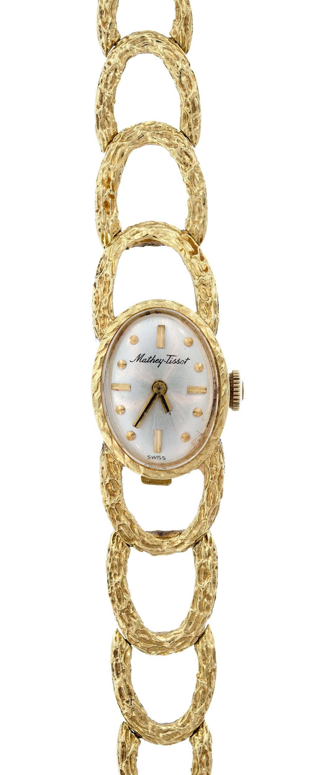 LADY'S VINTAGE MATHEY-TISSOT 14K GOLD WRIST WATCH.: A lady's, vintage, Mathey-Tissot wrist watch with textured link bracelet, mechanical movement, 14mm case, 6 11/16 inches long, 26.4 grams gross weight.