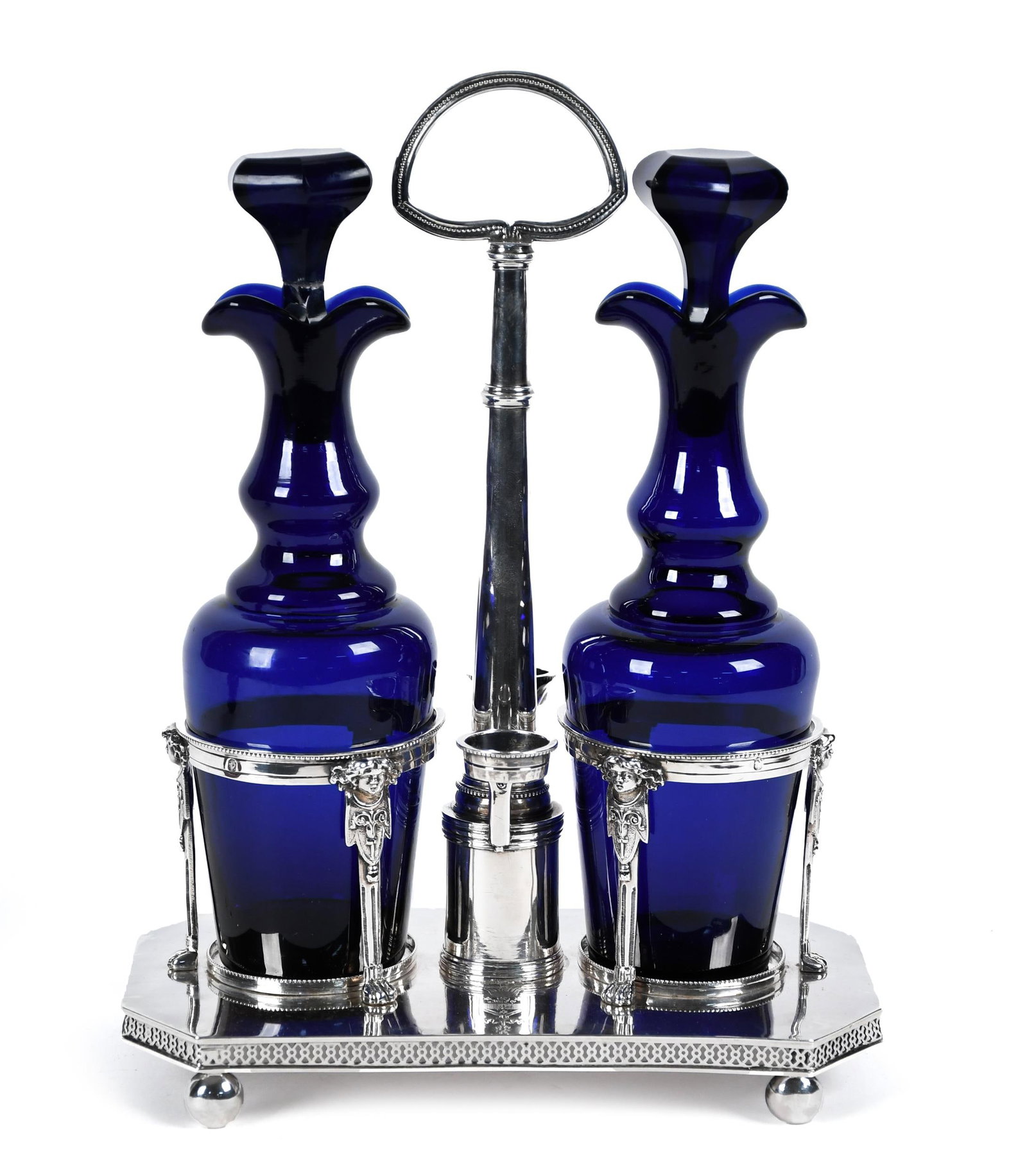 FRENCH SILVER TANTALUS WITH BACCARAT COBALT BOTTLES.: A French silver tantalus with hallmarks, and two Baccarat cobalt glass bottles. Tantalus 11”H x 8”W, bottles 9”H. Weight without bottles 19.8 oz t.