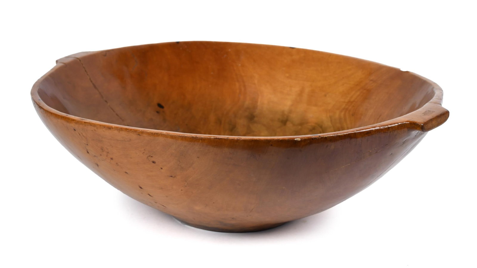 LARGE ANTIQUE CHERRY WOOD COPPING BOWL/TRENCHER.: A large antique oval carved cherry trencher or chopping bowl with integral lug handles. 8”H x 26”W.