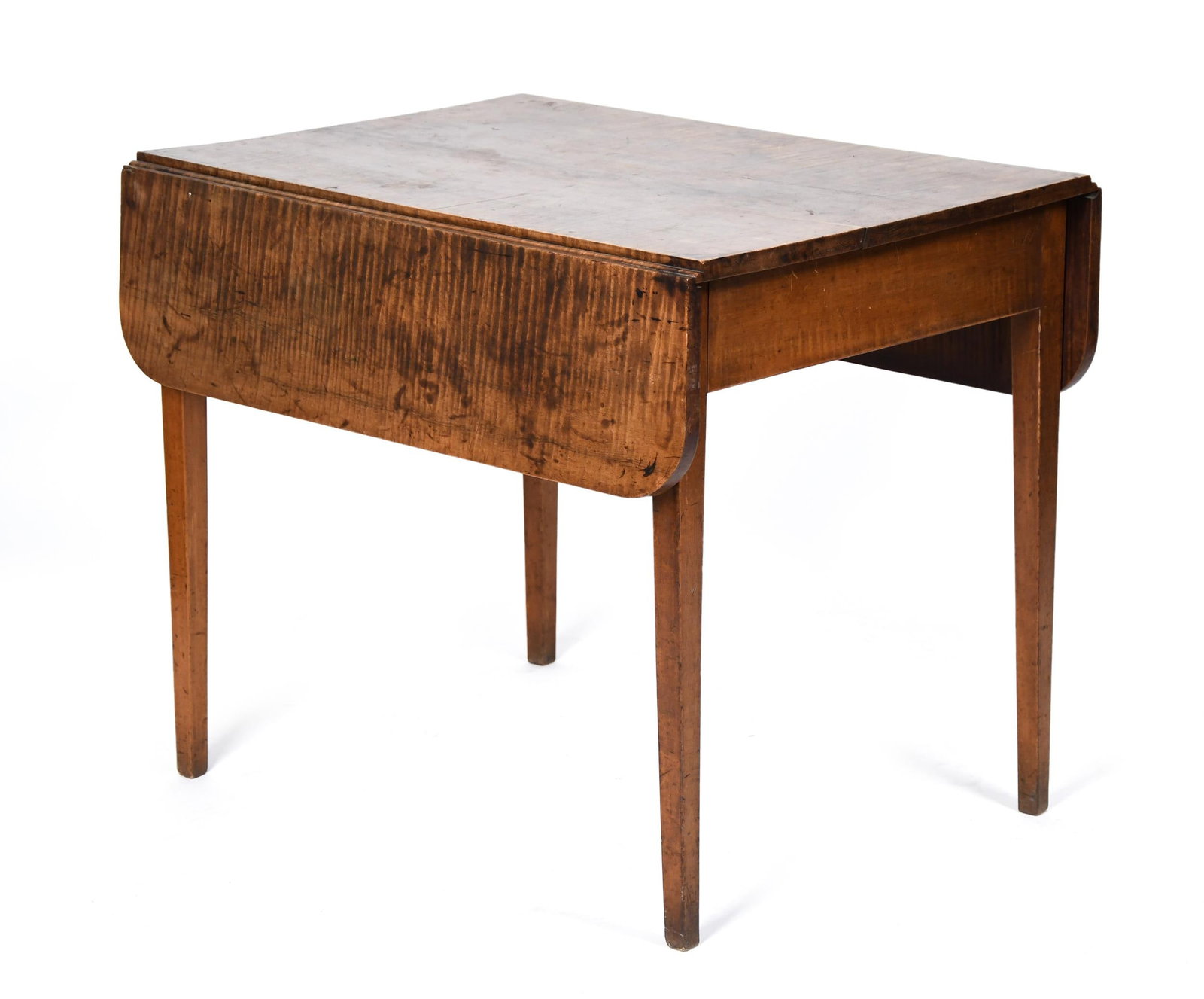 19TH C. TIGER MAPLE NEW ENGLAND DROP LEAF TABLE.: A ca. 1800 New England solid tiger maple country Hepplewhite drop leaf table with an old growth single board top, on tapered legs. 28”H x 33.75”L x 24.75”W (leaves down) x 41”W