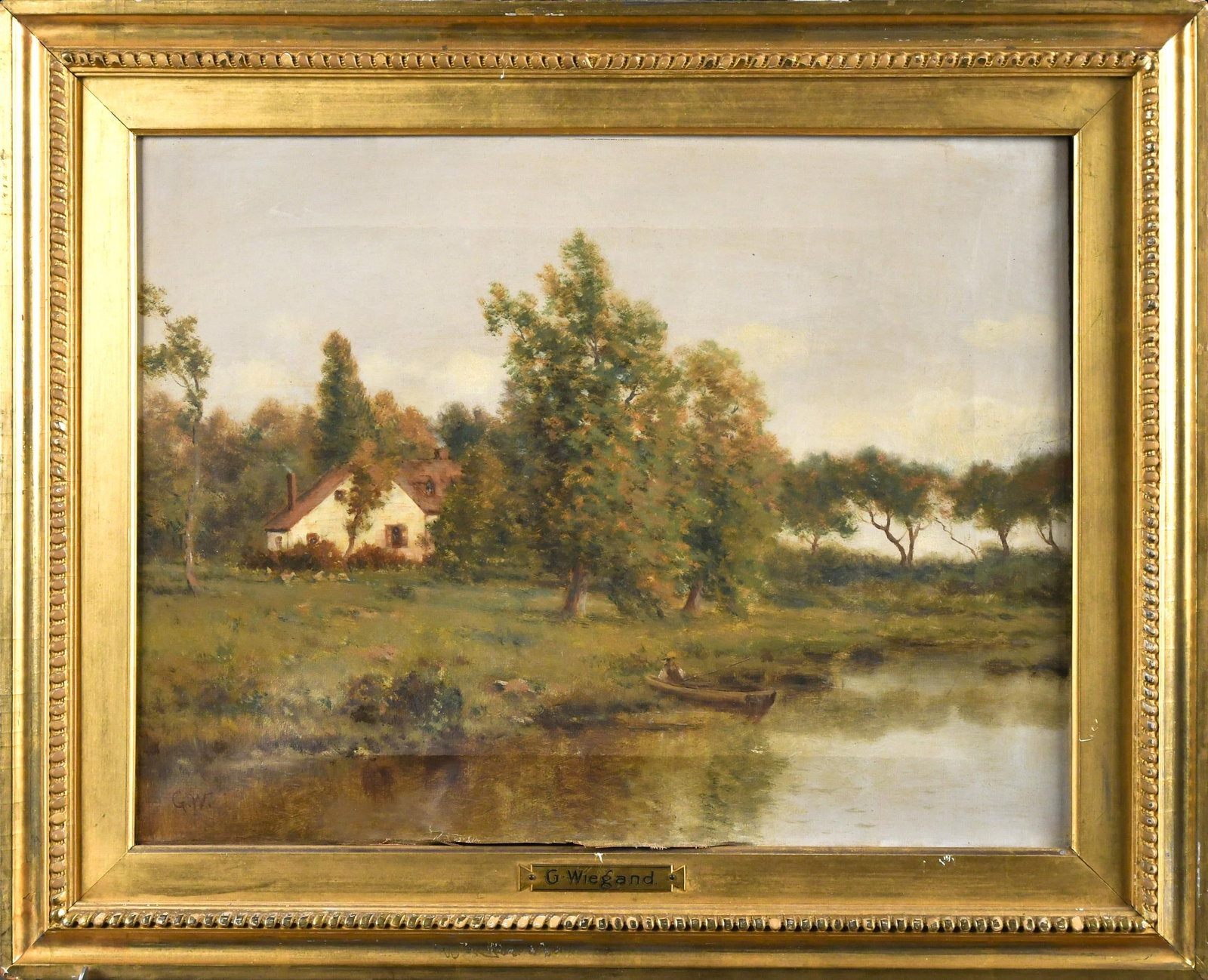 GUSTAVE WIEGAND OIL, LANDSCAPE.: An antique oil on canvas, attributed to Gustav Wiegand, depicting a pastoral scene with man in boat and cottage, initialed lower left G.W. Canvas 13” x 17”, Frame 18” x 21”.