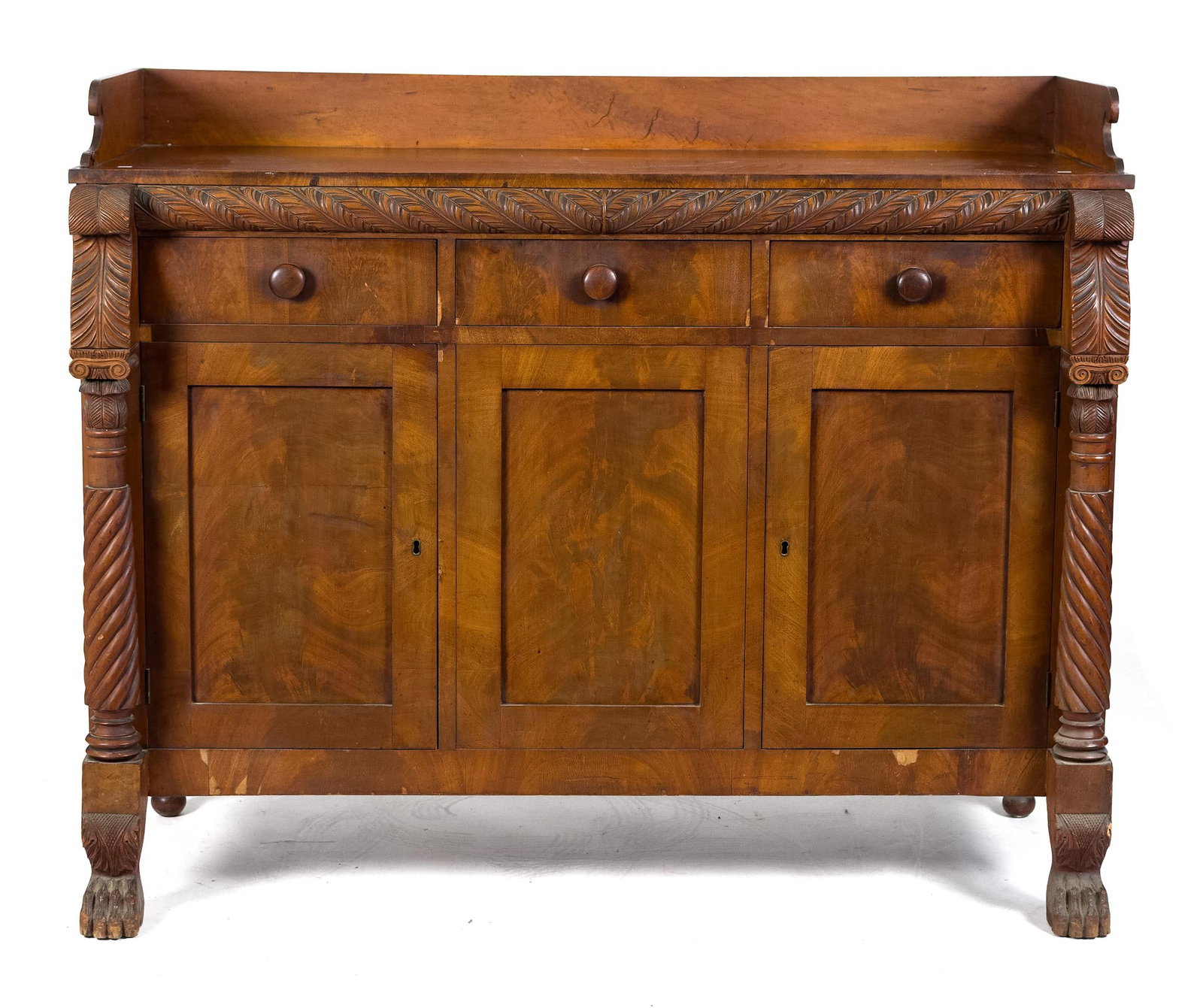 19TH C. NY CLASSICAL SIDEBOARD.: A ca. 1830 rural New York sideboard, cherry case construction with three doors under an elaborately carved frieze of twisted acanthus. Case flanked with carved columns of acanthus, topped by a project