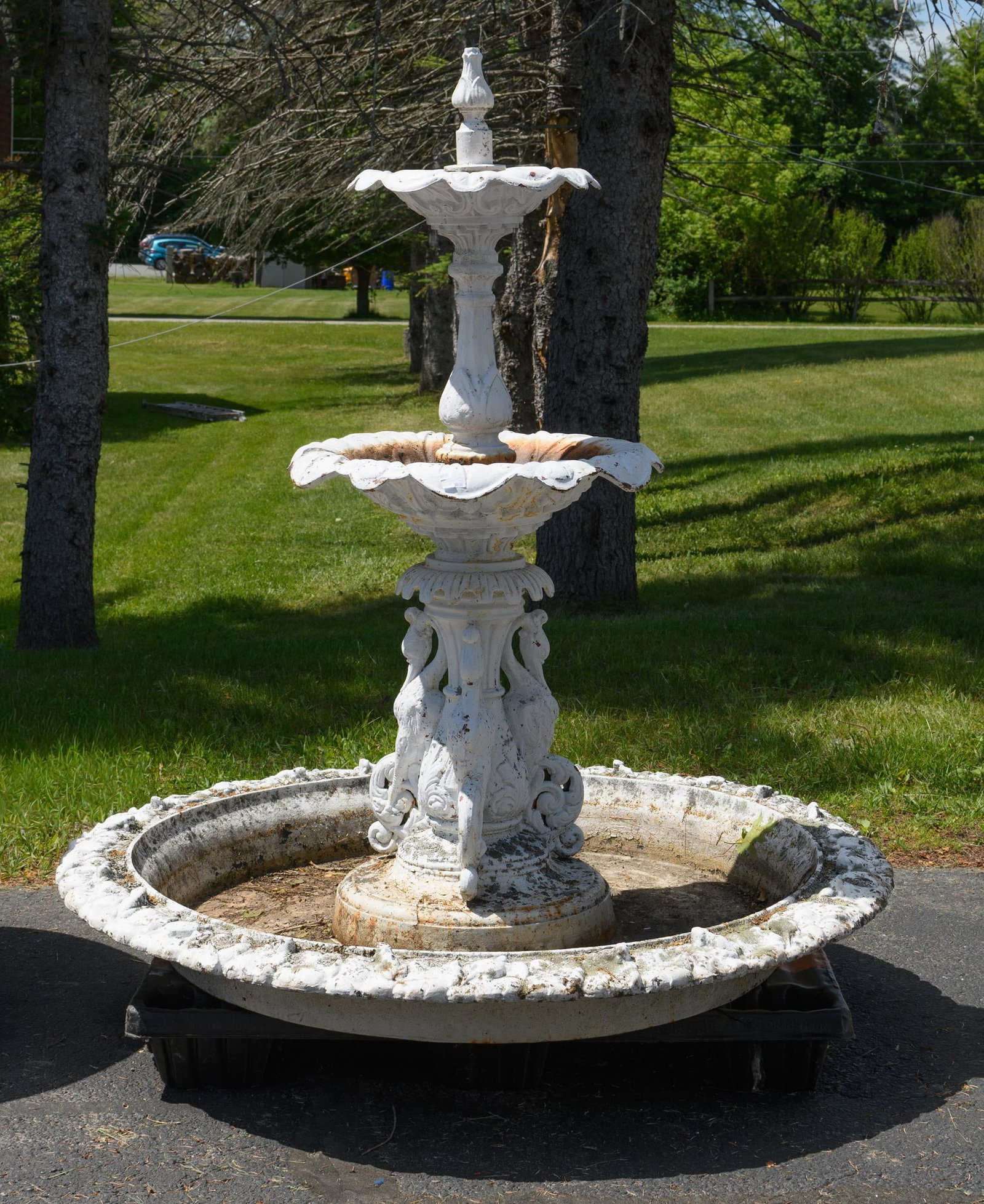 IMPRESSIVE ANTIQUE CAST IRON GARDEN FOUNTAIN.: An impressive antique two-part white painted cast iron garden fountain with swan motifs and a large lower bowl with fanciful border/edge and frog/turtle motifs. Approx. 72”H x 60” dia.