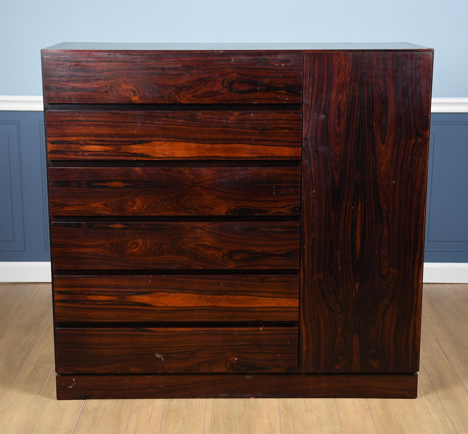 VINTAGE DANISH MODERN ROSEWOOD WARDROBE.: A vintage 20th C. rosewood wardrobe with a single door and six drawers. 43”H x 45”W x 18”D.