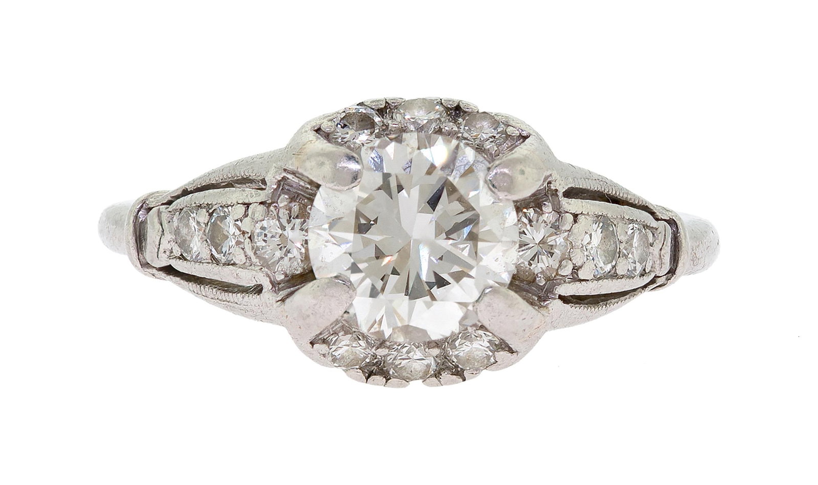 VINTAGE PLATINUM .90 CT. DIAMOND ENGAGEMENT RING.: A vintage, platinum (stamped) ring set with an approx. .90 ct., round brilliant cut, natural diamond of J-K color and VVS clarity and approx. .27 ct. tw. round brilliant cut, natural diamonds of G-H