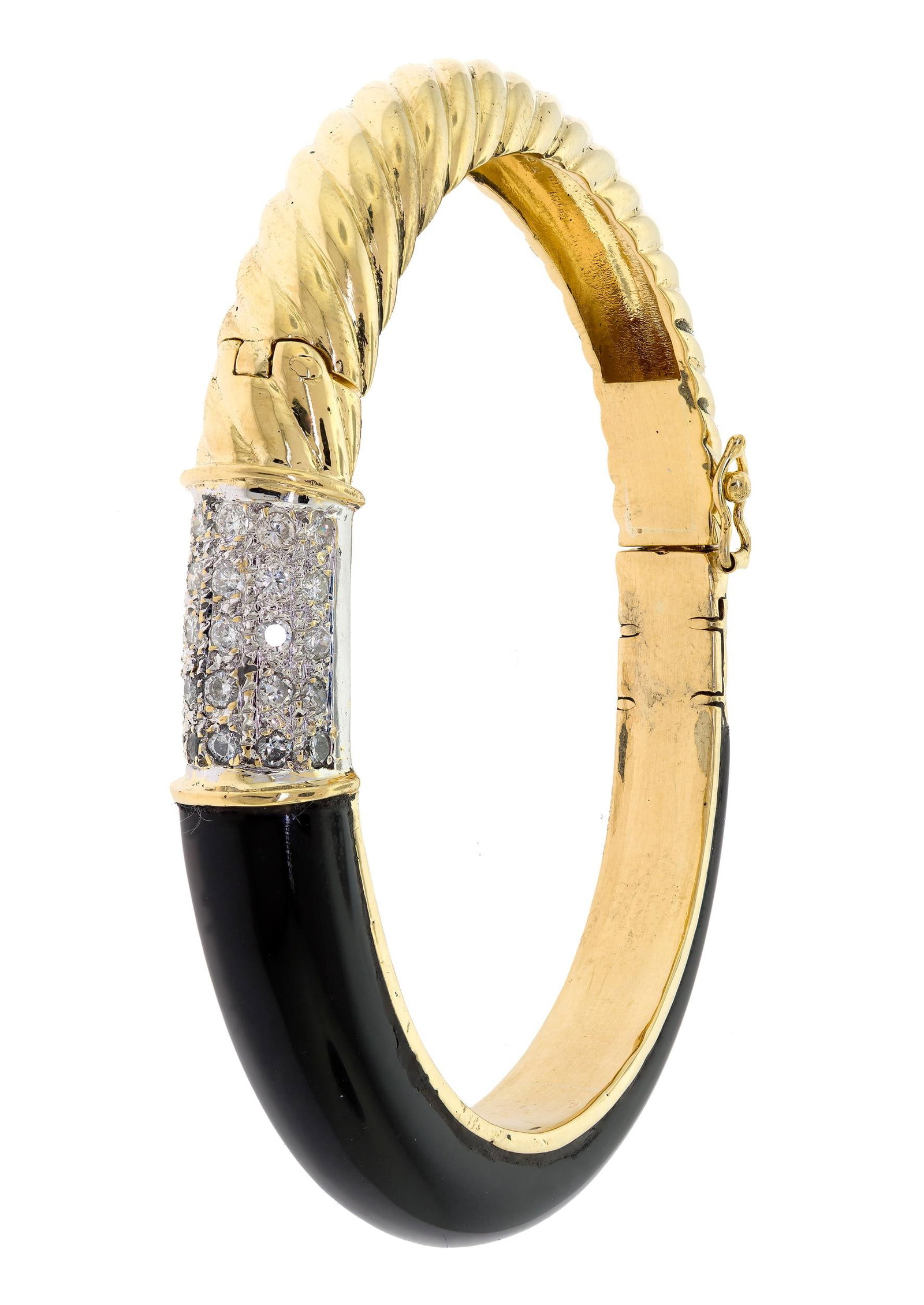 18K GOLD BLACK ONYX & DIAMOND BANGLE BRACELET.: A 18k yellow gold (stamped), black onyx, hinged-bangle bracelet set with approx. .75 ct. tw., round brilliant cut, natural diamonds of G-H-I color and VS-SI clarity, 10mm wide, 6 1/2 inch wrist, 42.5 