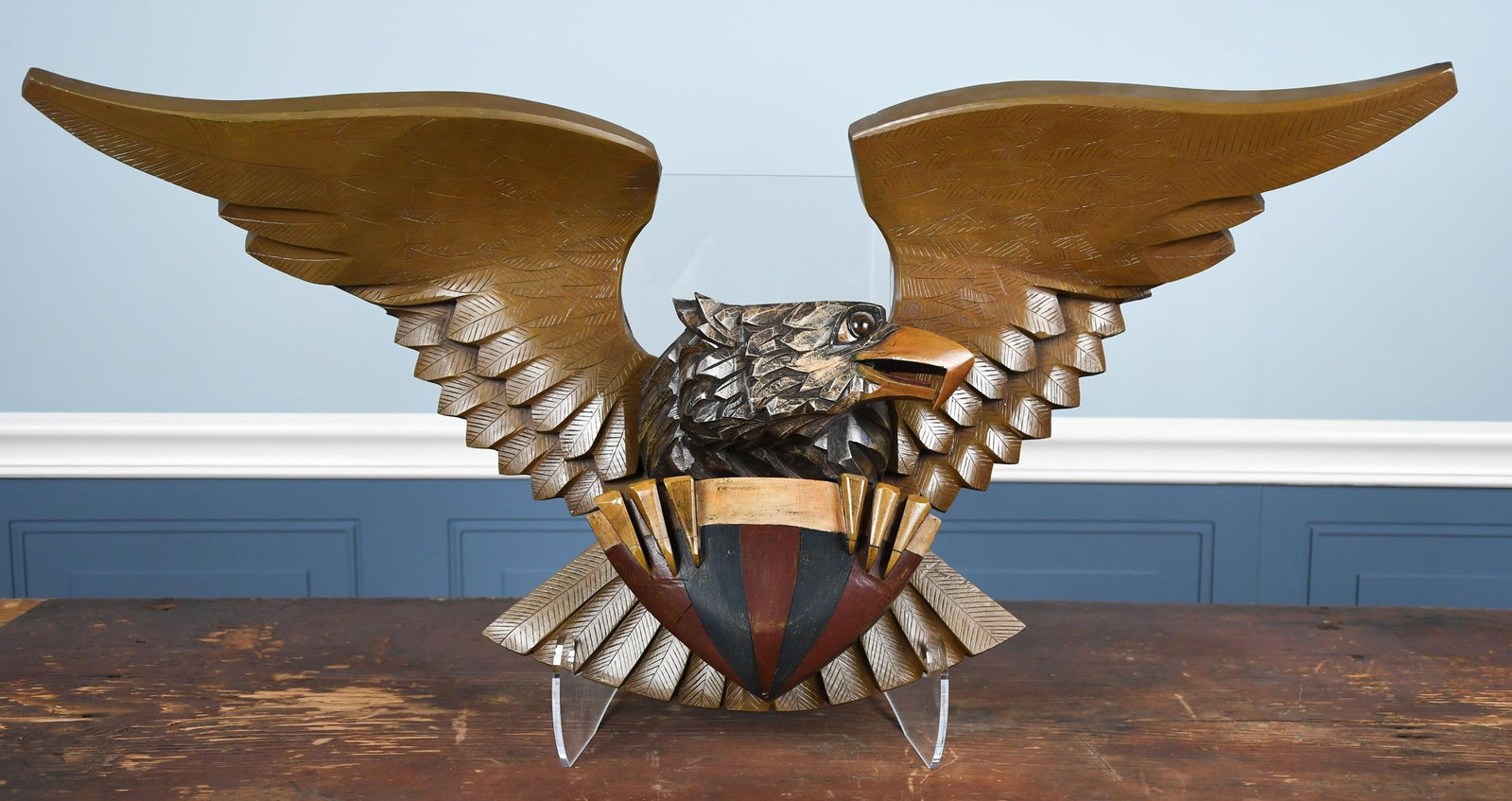 WARREN KIMBLE & BILL HOLWAY CARVED WOODEN EAGLE.: A 20th C. folk art eagle, carved by Bill Holway and painted by Warren Kimble. Signed on reverse and dated 1993. 16”H x 36.5”W. Provenance: Warren Kimble Private Collection.