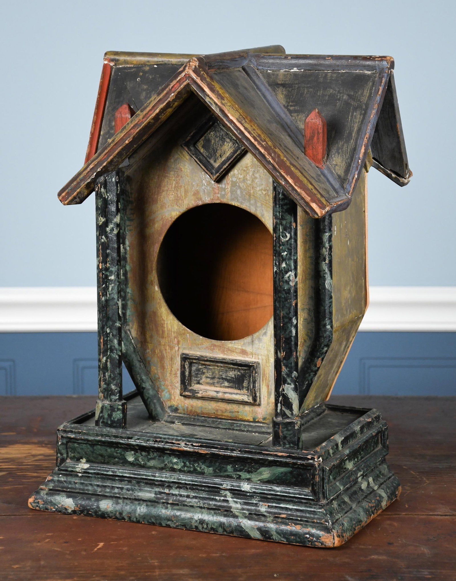 20TH C. FOLK ART PAINTED BIRD HOUSE: A 20th C. painted wooden house-form bird house, with faux marble decoration. 17.5”H x 13”W. Provenance: Warren Kimble Private Collection.