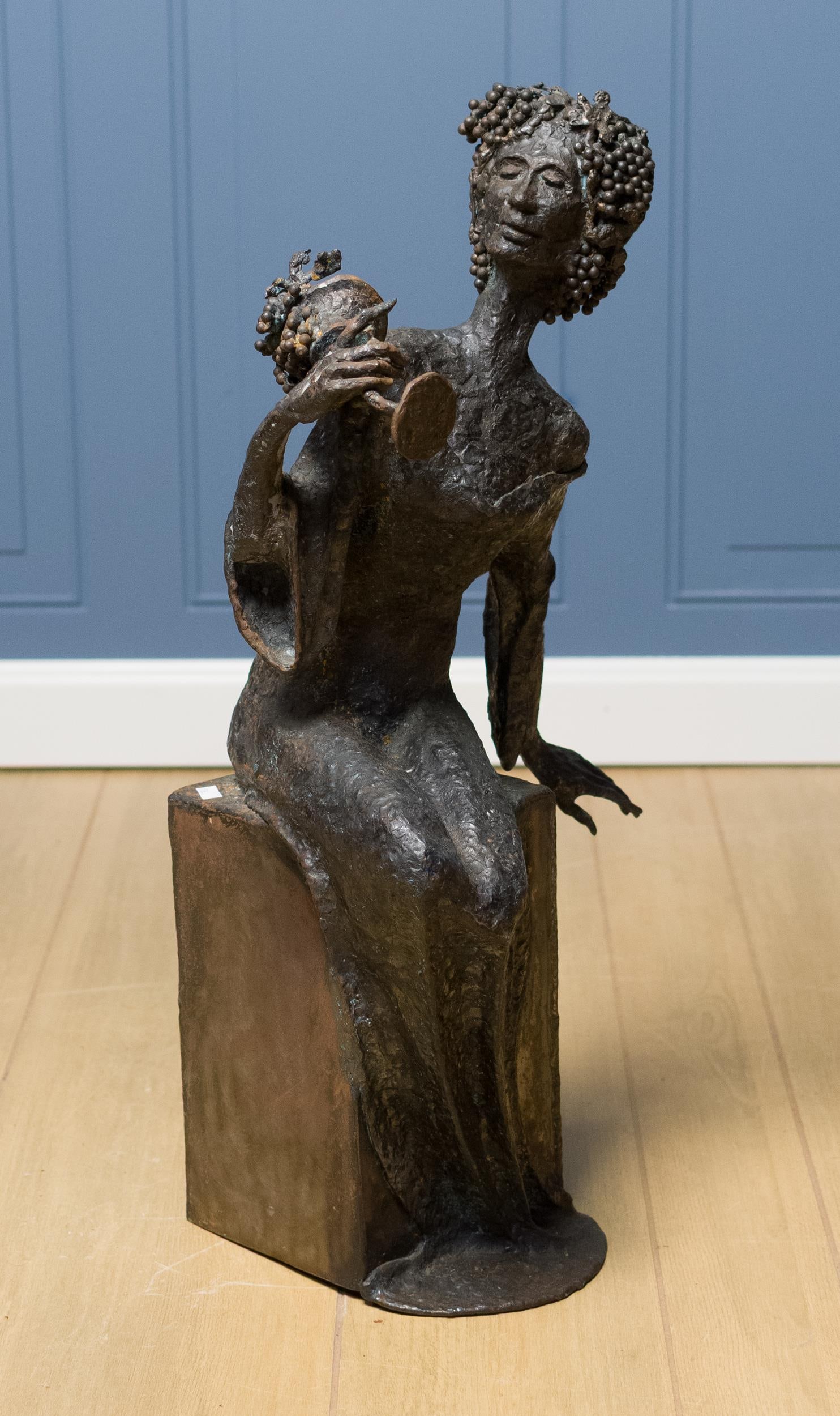 ACHILLE FORGIONE IRON SCULPTURE, GODDESS OF WINE.: An Achille Forgione iron sculpture, the goddess of wine seated on a plinth. 26”H