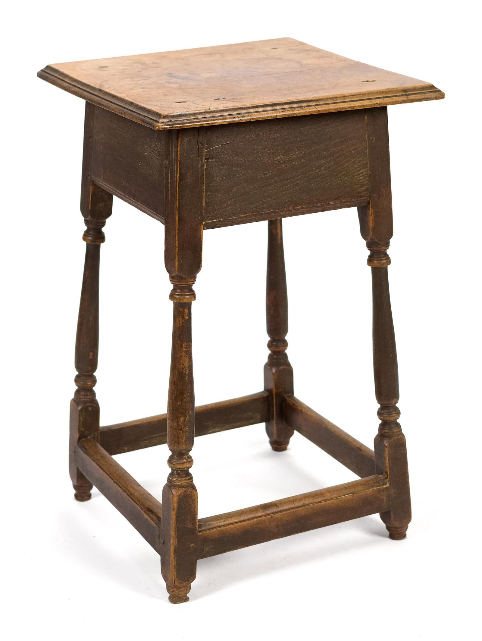 18TH C. NE PAINTED MAPLE SMALL TAP TABLE,: A ca. 1730 New England maple tap table in an old dry scraped Spanish brown color. A carved molded edge square top resting on a vase and ring turned splayed leg base with box stretchers, 27”H x 1