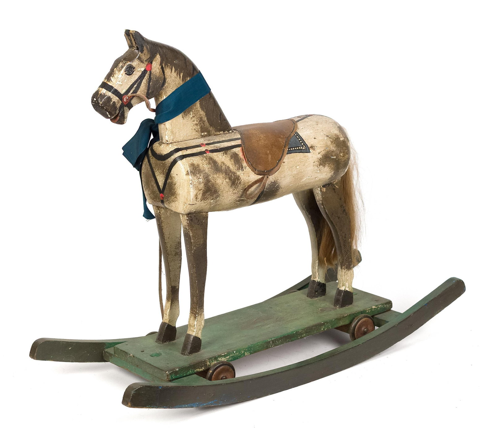 ANTIQUE PAINT DECORATED CHILDS ROCKING HORSE.: An antique handmade child’s rocking horse toy with original dapple body paint with a leather saddle and real hair tail. 25”H x 32”L x 12”D. Provenance: from the lifelong,