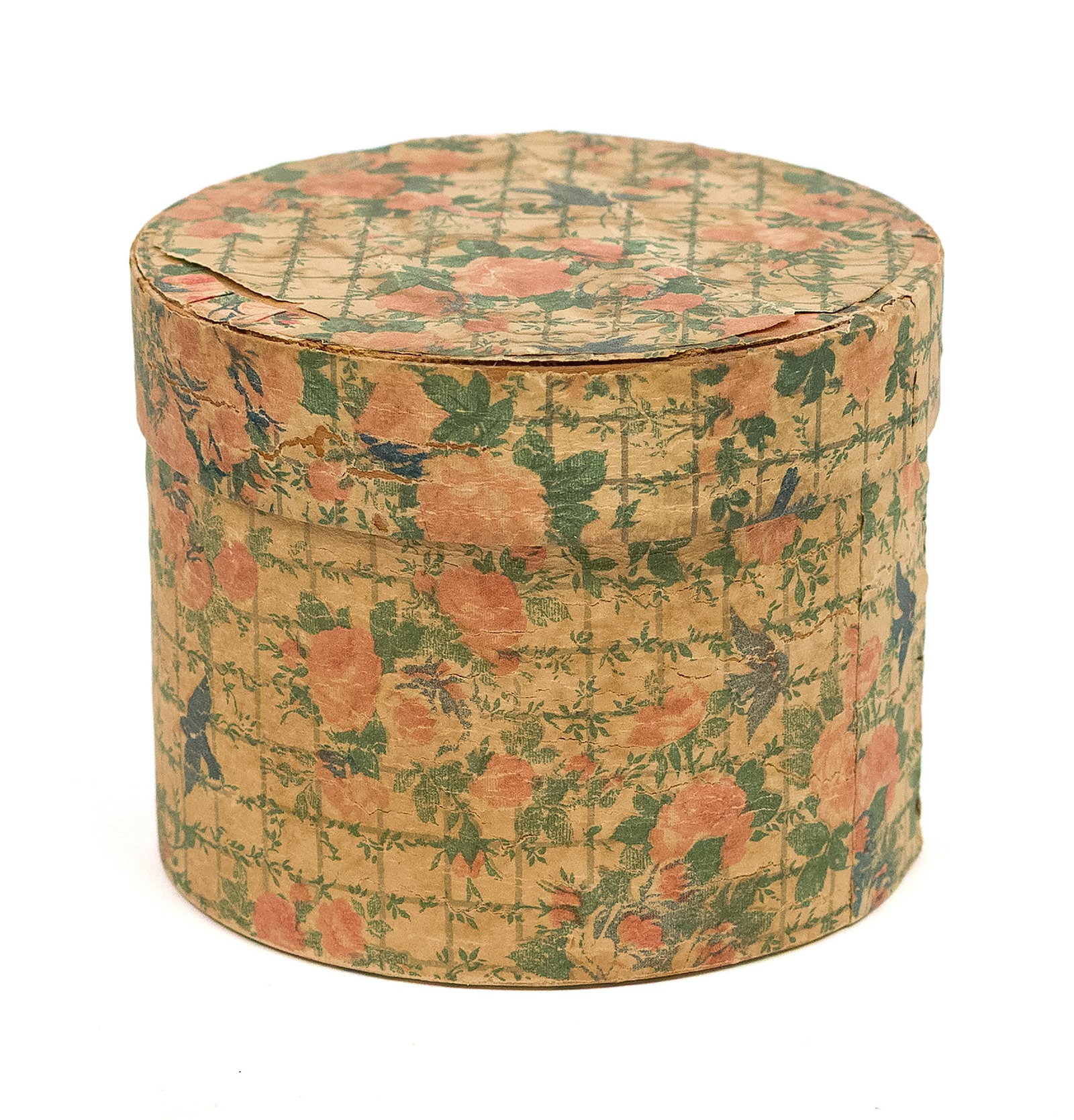 MINIATURE HANNAH DAVIS LABELED HAT BOX.: An antique miniature and possibly a salesman sample circular wallpaper hat box, with an adhered labeled on underside of lid, ‘Hannah Davis Bandbox MFR. Jaffrey NH. 3”H x 3.75” dia. P