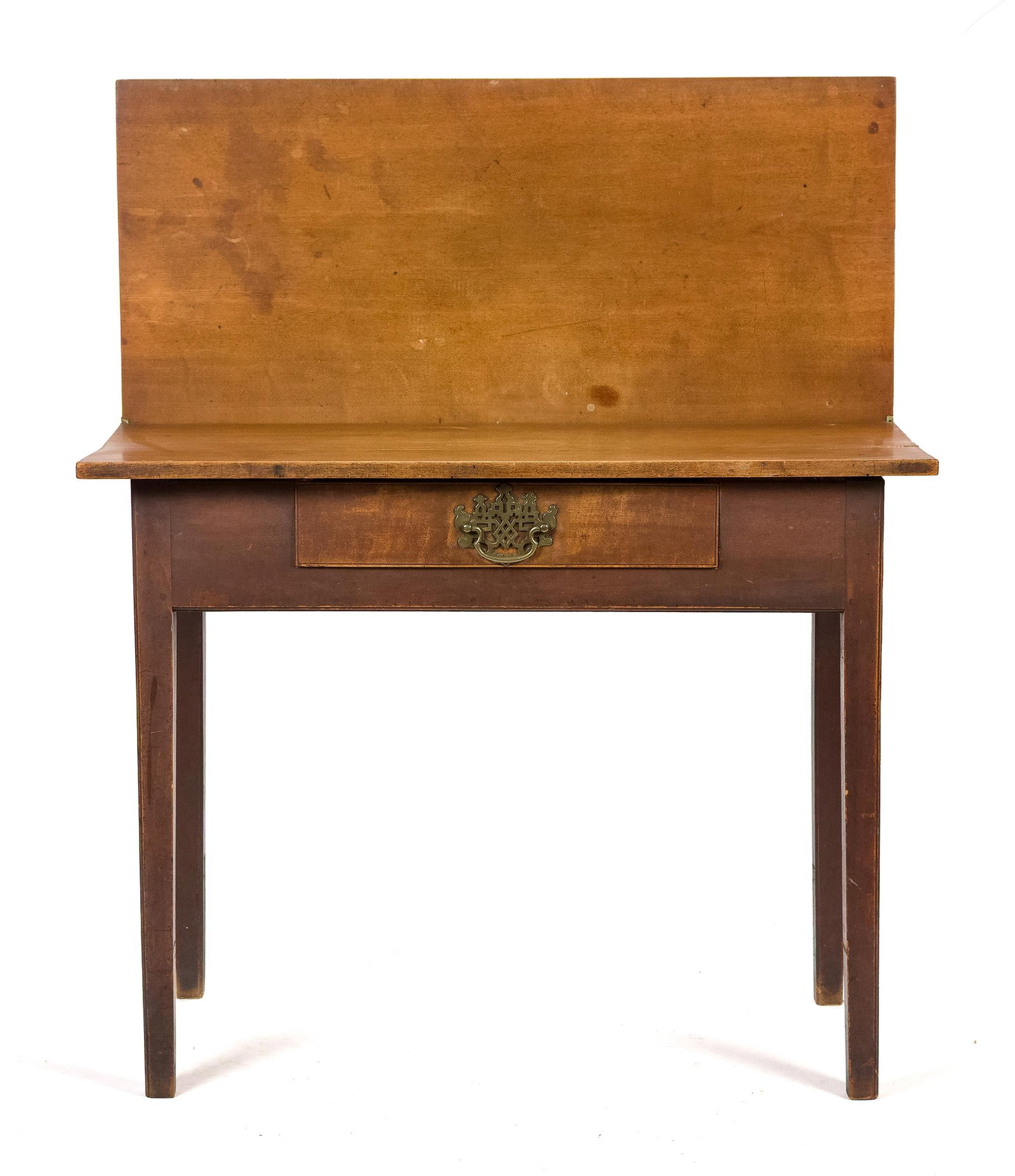 CHIPPENDALE NH CHERRY GAMES TABLE.: A ca. 1780 NH Chippendale cherry games table with the original finish and brass. A rectangular hinged lift top and swing back leg support, one dovetailed drawer in the apron on straight Chippendale le