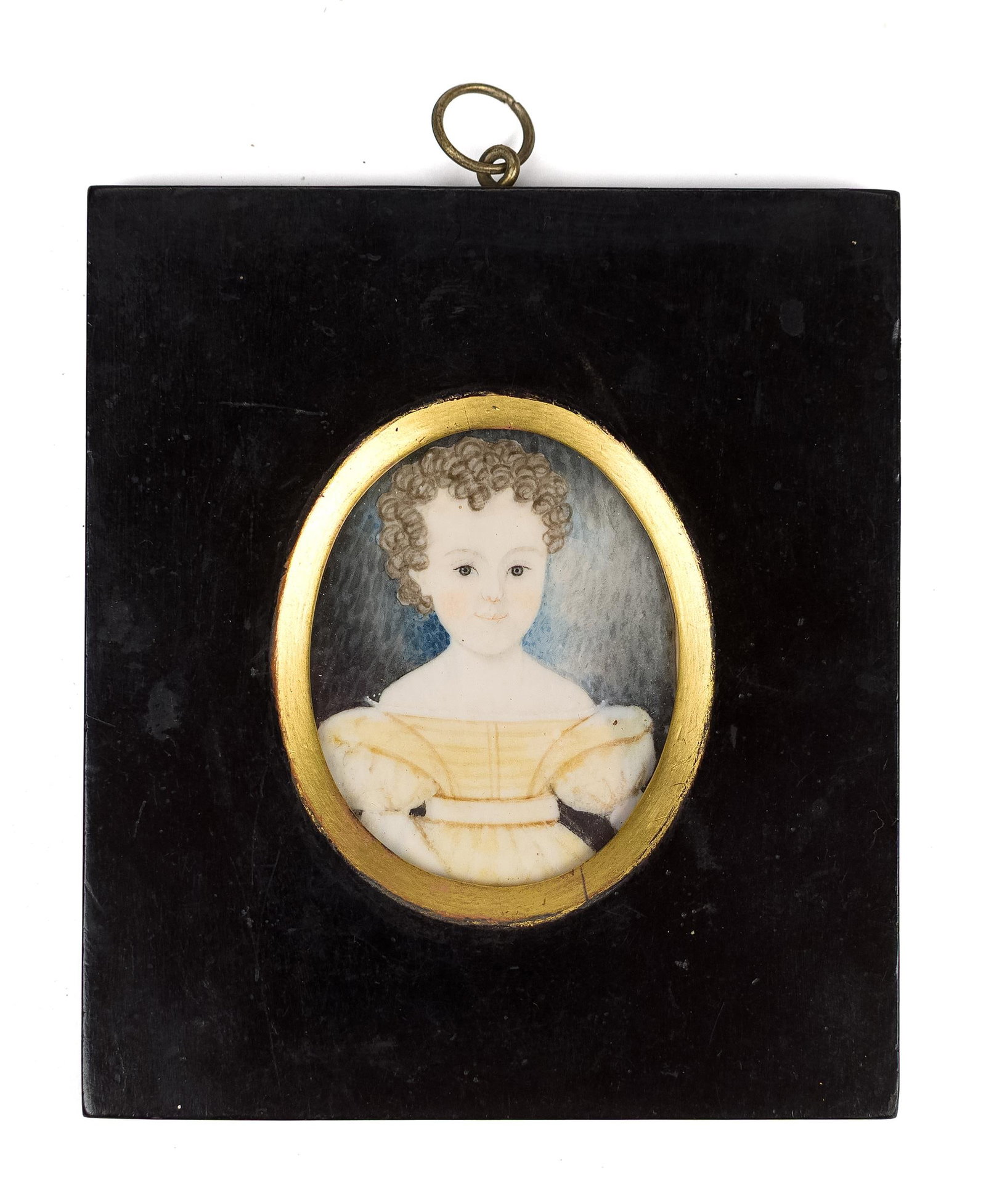 19TH C. MINIATURE PAINTING, CHILD IN YELLOW DRESS.: An early 19th C. Miniature painting, depicting, a curly haired child wearing a yellow dress, in a period frame, reverse reads Francis Eduard Fox. Image 2.25” x 1.75”, Frame 4.25” x 3