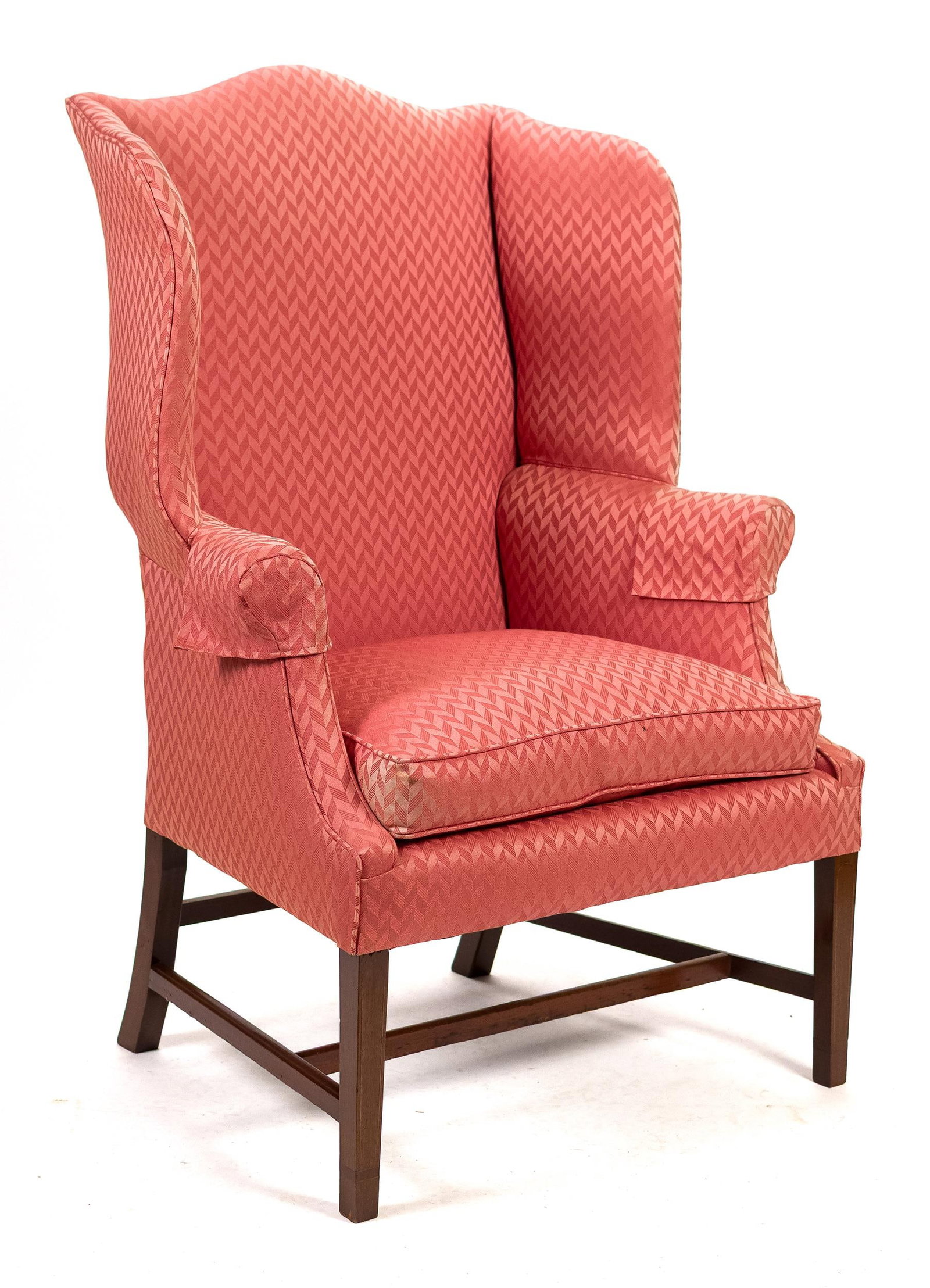 FEDERAL INLAID MAHOGANY WING CHAIR.: A ca. 1790 Federal New England inlaid mahogany easy chair, of exceptional form. A serpentine top crest rail, shaped wings and high rolled arms, on a fine tapered leg base with line inlays and cuffs, p