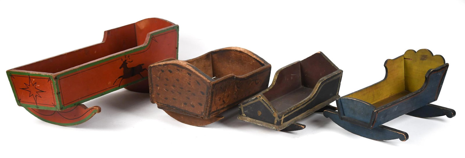 FOUR ANTIQUE PAINT DECORATED DOLLS CRADLES.: A nice assortment of 19th C. New England dolls cradles in original paint decoration, 12” to 20”L. Provenance: from the lifelong, curated collection of Kathy Schoemer, Walpole, NH.