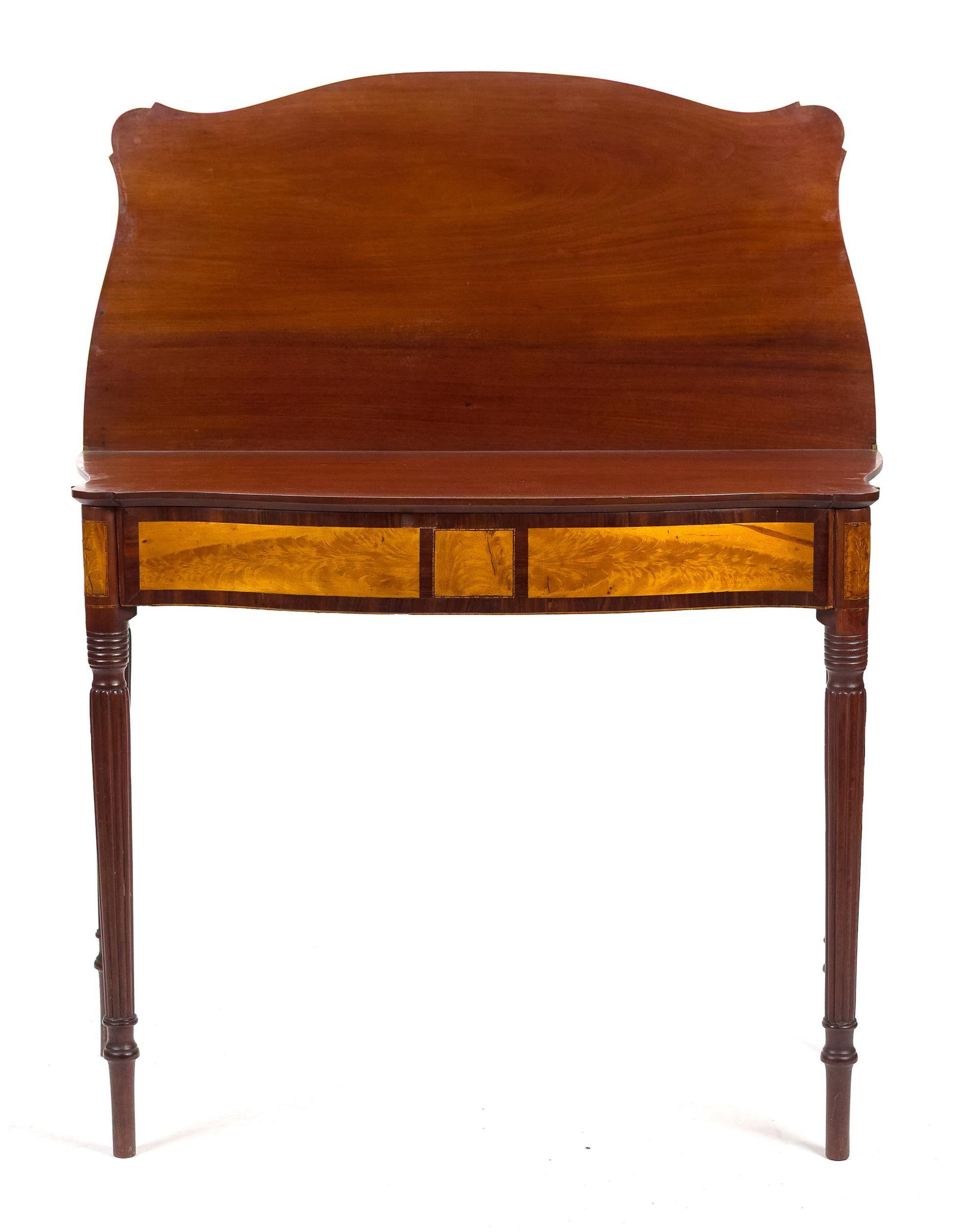 FINE FEDERAL NH INLAID GAMES TABLE.: A ca. 1810 New Hampshire inlaid mahogany games table with a serpentine front and sides adorned with flame birch panels, on delicate reeded legs, 29.5”H x 36”W x 17”D. Provenance: the