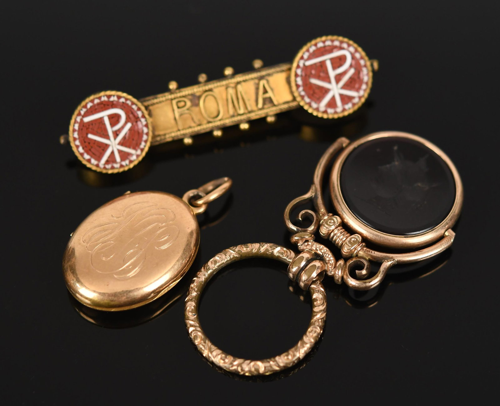 ANTIQUE GOLD & GOLD-FILLED JEWELRY.: Antique, yellow gold and gold-filled jewelry: signed, Tiffany & Co., 14k gold oval locket, inscribed, June 10, 1896, with monogram, glass on one side, 1 5/16” long, 9.2 grams, bail is worn;
