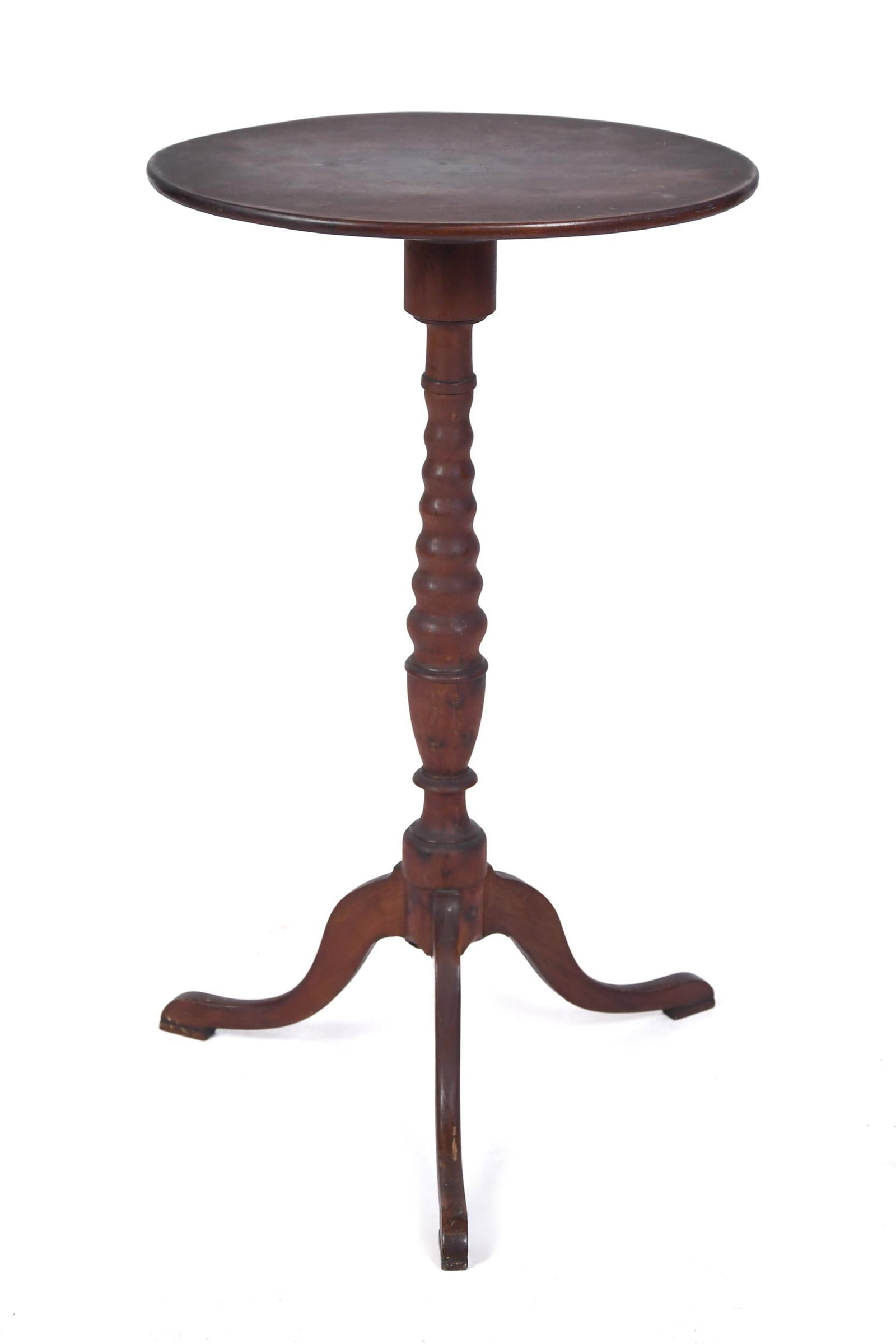 19TH C. FEDERAL OVAL TOP CANDLESTAND, OLD SURFACE.: A unique and rare ca. 1810 American mahogany candlestand in the old surface, oval top with a uniquely graduated spool turned column and down-swept carved legs. 27.75”H x 16” x 12”