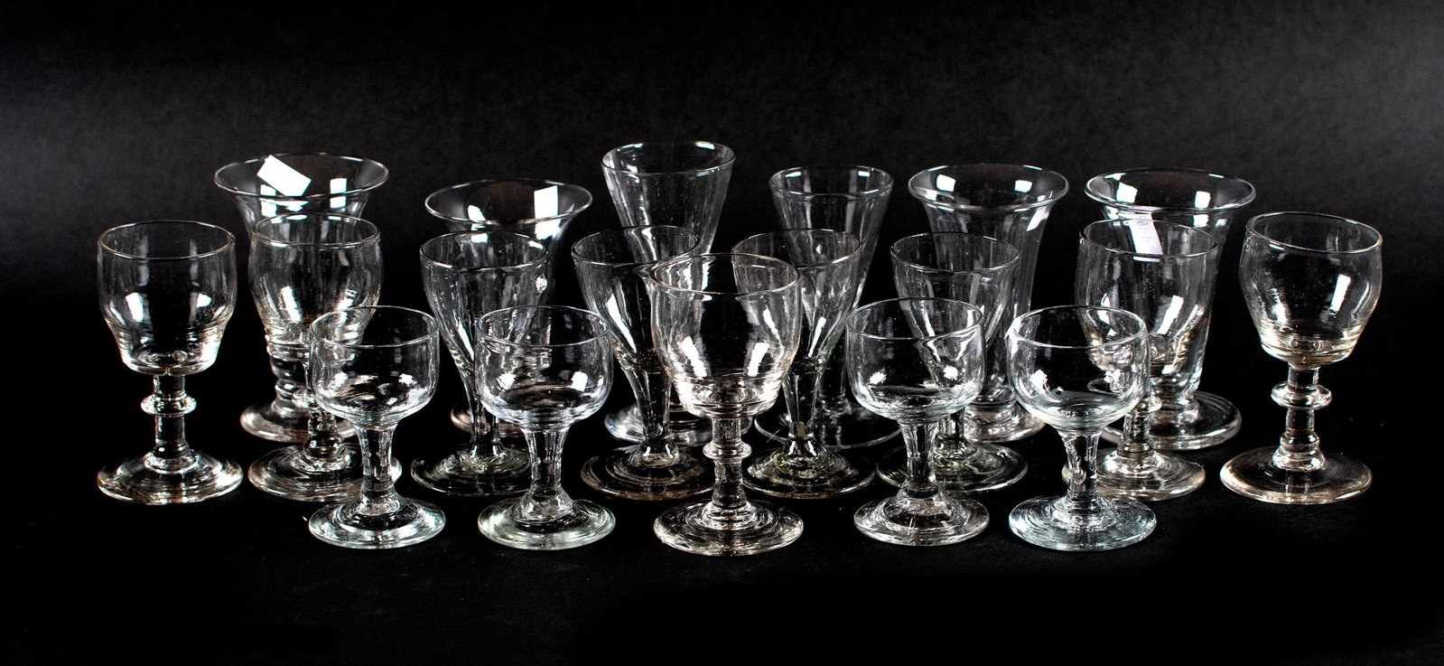 18TH C. HANDBLOWN STEMWARE, 19 PCS.: 19 pcs of small, delicate 18th C. hand-blown stemware, ex-collection Richard Bowen of Barrington, Rhode Island. Included are five basic shapes with some variation. Sizes range 3.5”H x 2”W