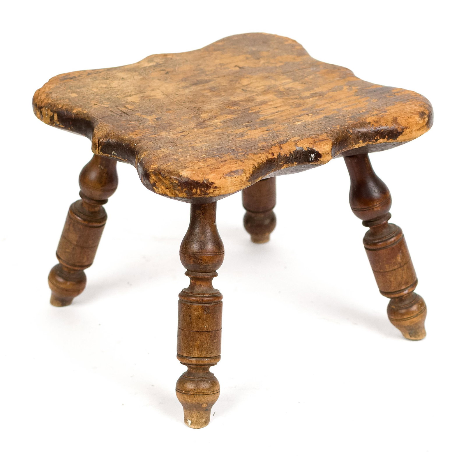 ANTIQUE WINDSOR FOOTSTOOL.: A 19th C. or earlier, Windsor footstool. A scalloped pine top and maple turned legs, 9”H x 10.5” sq. Provenance: the estate of Donald Roach Barrington RI.