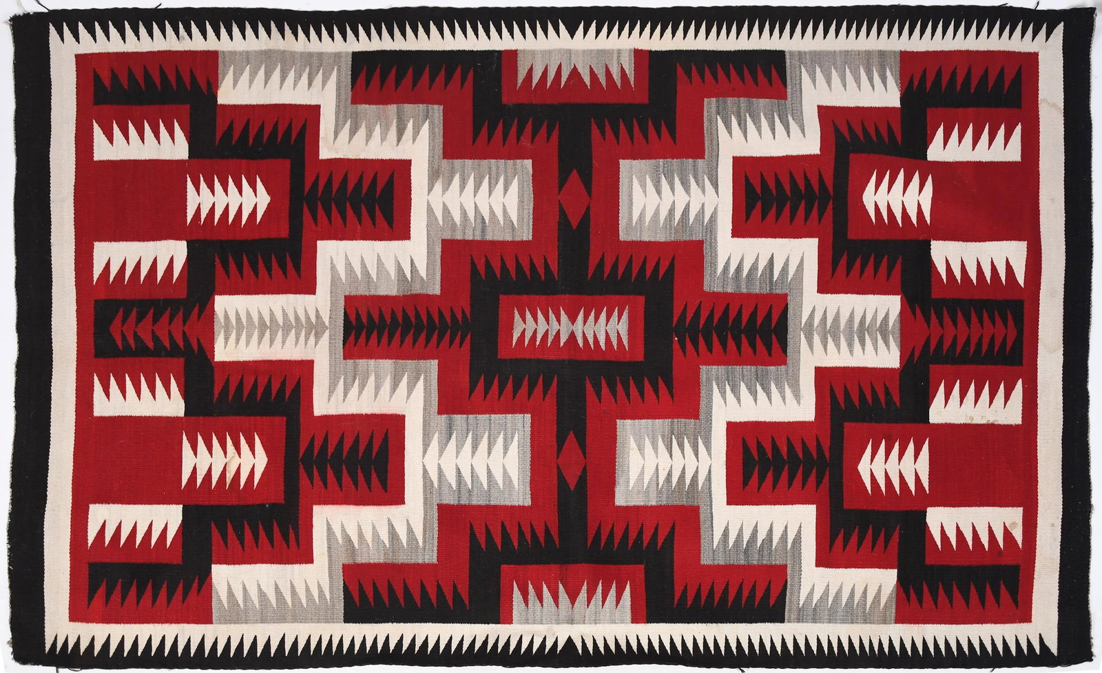 CA. 1930 NATIVE AMERICAN NAVAJO GANADO WOOL BLANKET.: A 20th C. Native American wool blanket, Navajo Ganado block pattern with red, black, ivory and grey colors, 4’3” x 5’ 1”.