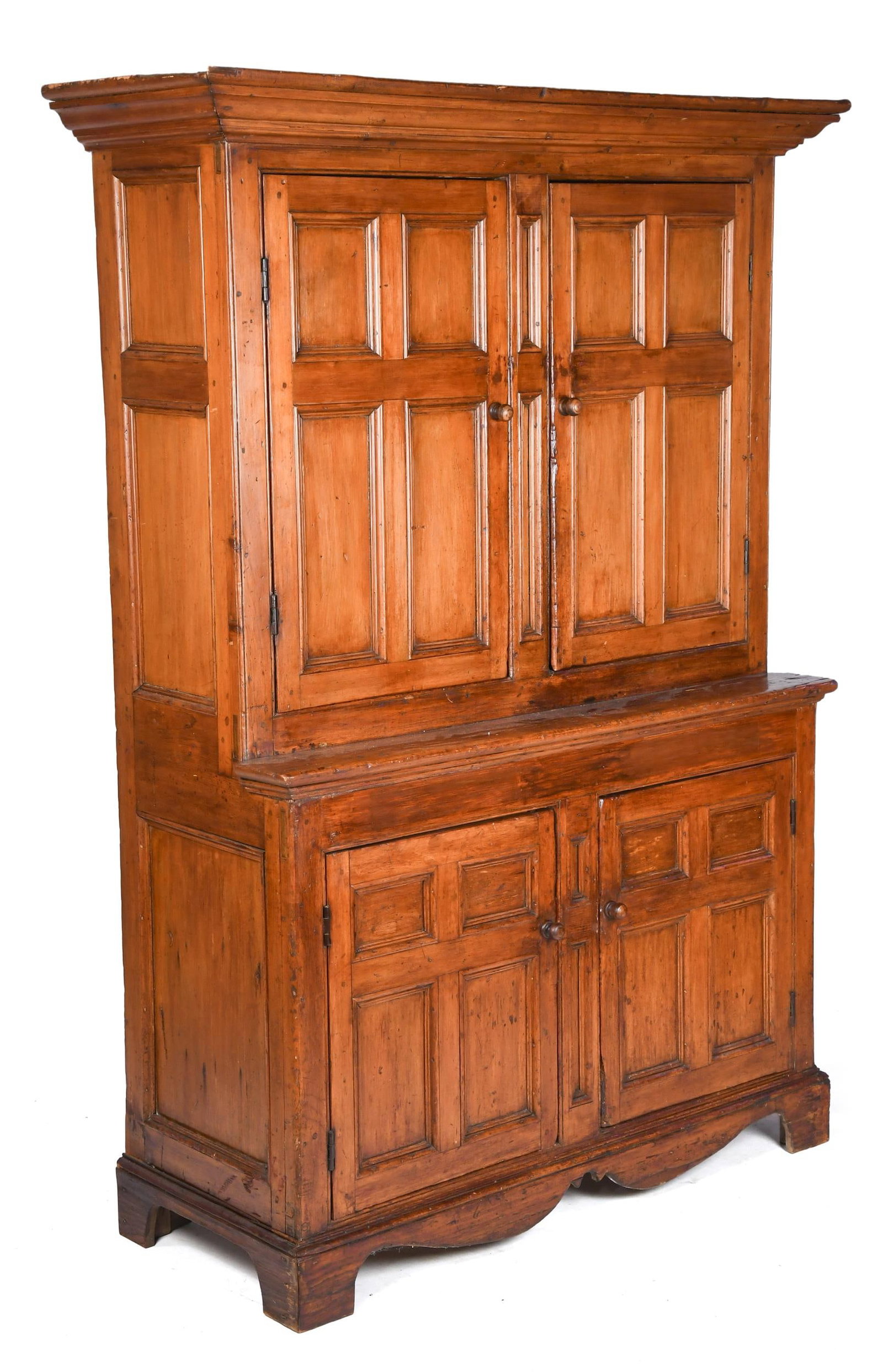 LATE 18TH C. CANADIAN FLOOR CUPBOARD.: A ca. 1790 Canadian single part floor cupboard, applied cornice molding over four paneled doors and molded case. 76.5”H x 55”W x 22”D.