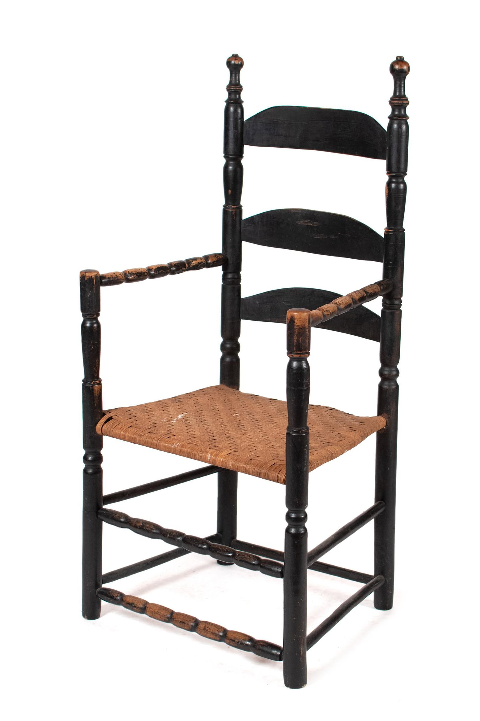 18TH C. AMERICAN LADDER BACK ARMCHAIR.: A mid 18th C. American (likely Salem MA) black painted maple ladder back armchair with sausage turned arms and front stretchers. 45” H x 21” W x 18.5D x 16” Seat height.