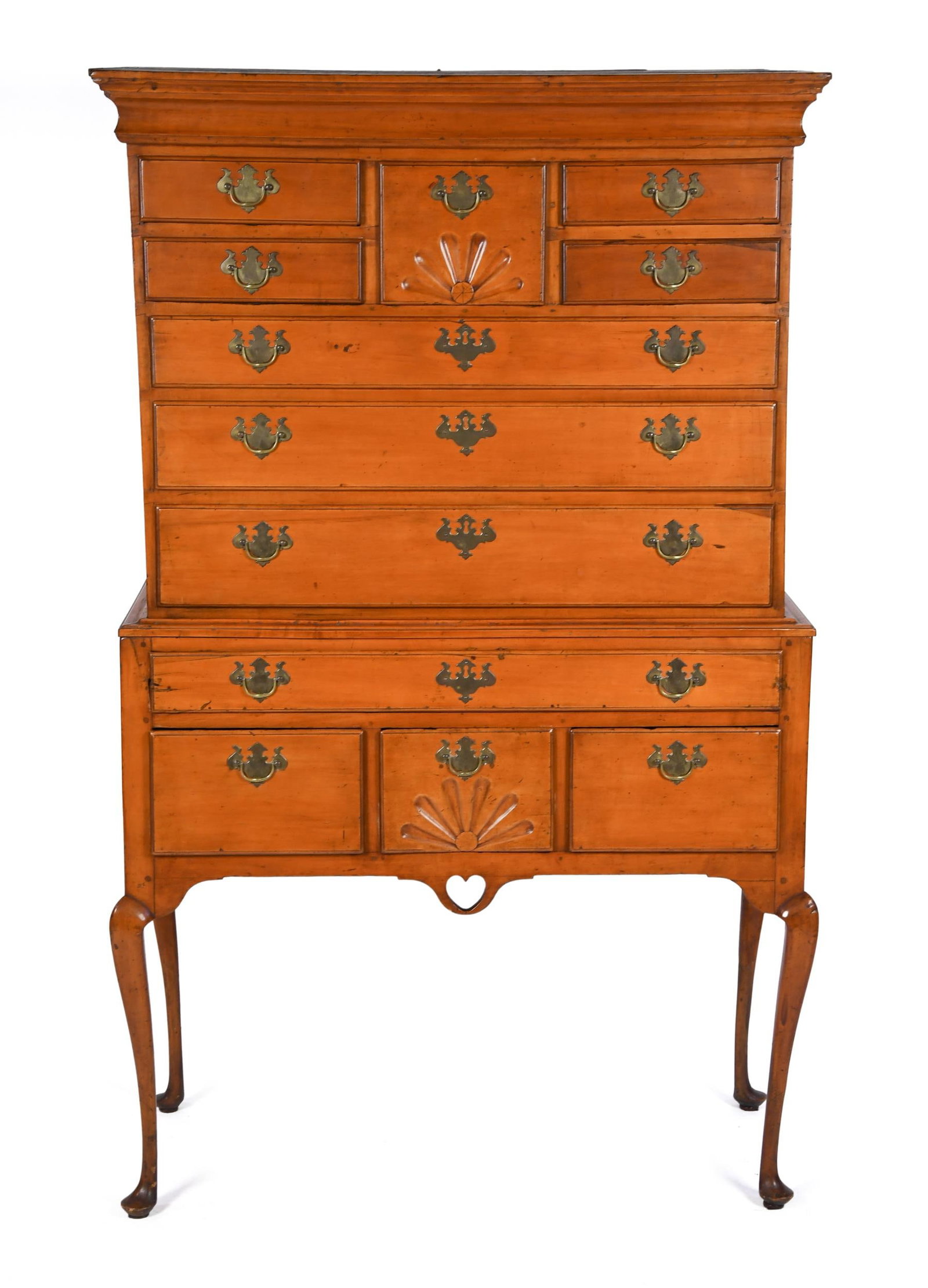 18TH C. QUEEN ANNE COASTAL MAPLE HIGHBOY.: An unusual ca. 1760 coastal New England maple two part highboy. The upper section with a bold double step molding, and a central fan carved bonnet drawer, flanked by seven drawers. The base section