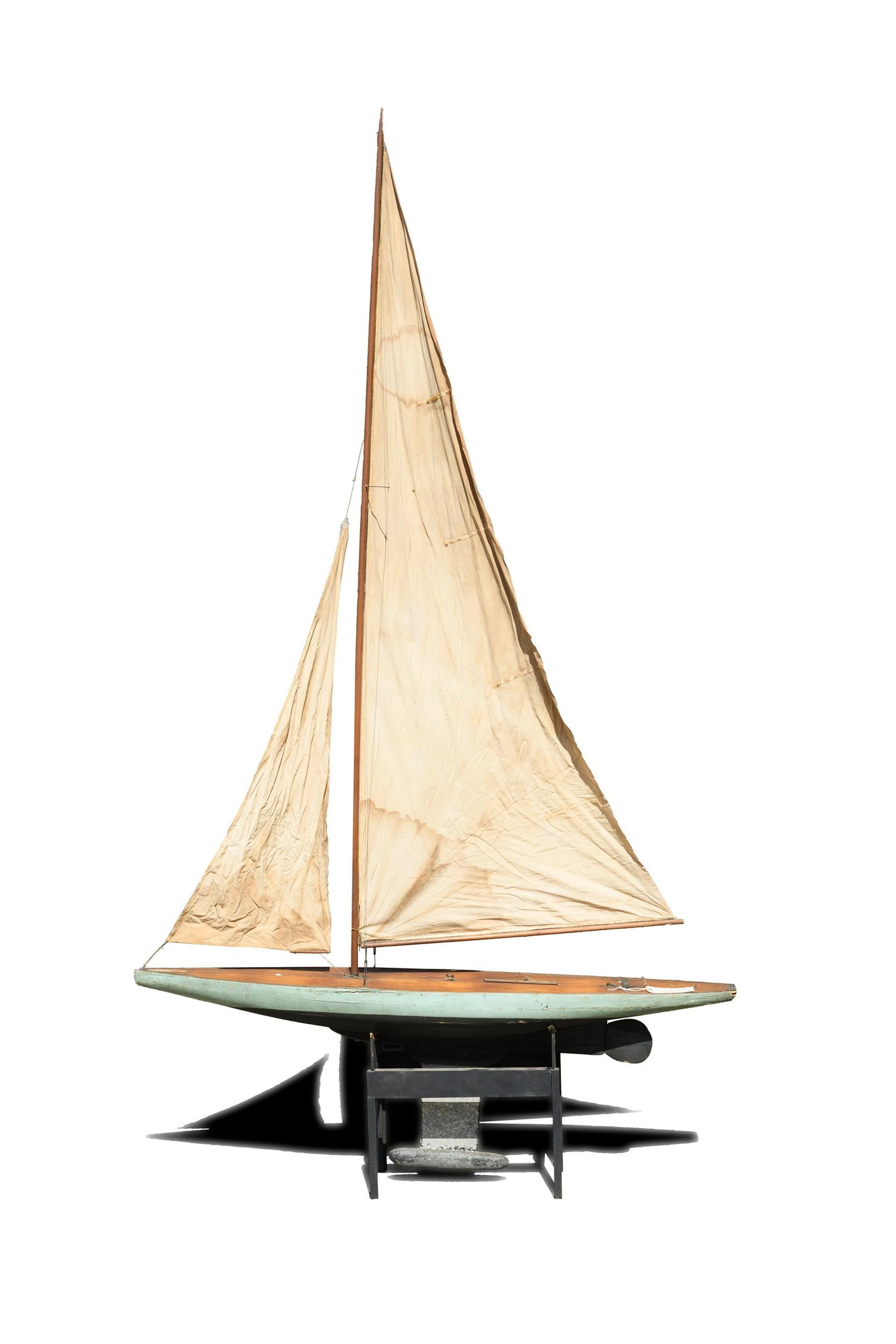ANTIQUE POND BOAT W/SAILS.: A ca. 1900 well made pond boat, painted hull with original sale owned by John Robert Synnott 1871-1942 sailed in Central Park New York City, with a later made stand, boat 61”L x 105” H.