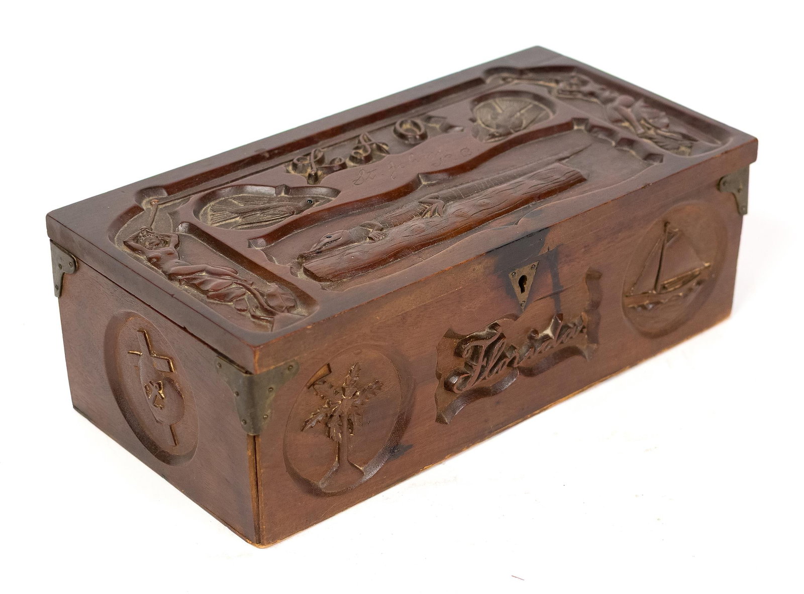 ANTIQUE CARVED FOLK ART FLORIDIAN BOX.: A ca. 1900 mahogany folk art box carved by uncle Frank to LuLu, depicting alligator, birds, fish, boats, anchors, nude woman and titled Florida, 4”H x 12”L x 6.25”D.