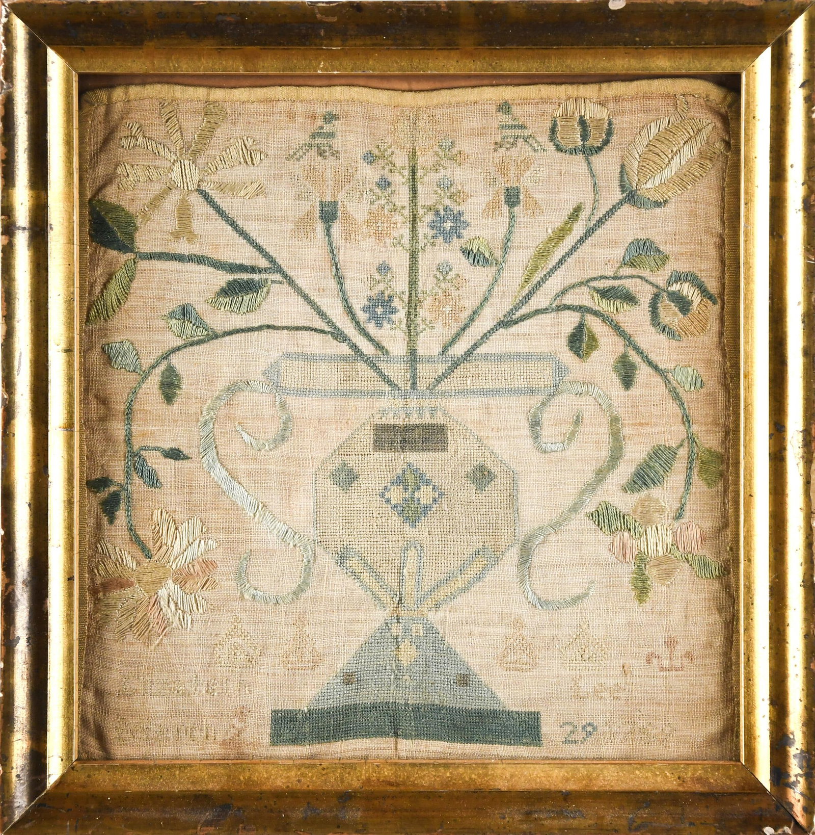 18TH C. SAMPLER, ELIZABETH LEE.: A wonderful needlework sampler depicting a theorem basket, wrought by Elizabeth Lee March 8, 1769? In a period lemon gold frame, overall 9“ x 9“. Provenance: from the lifelong, curated
