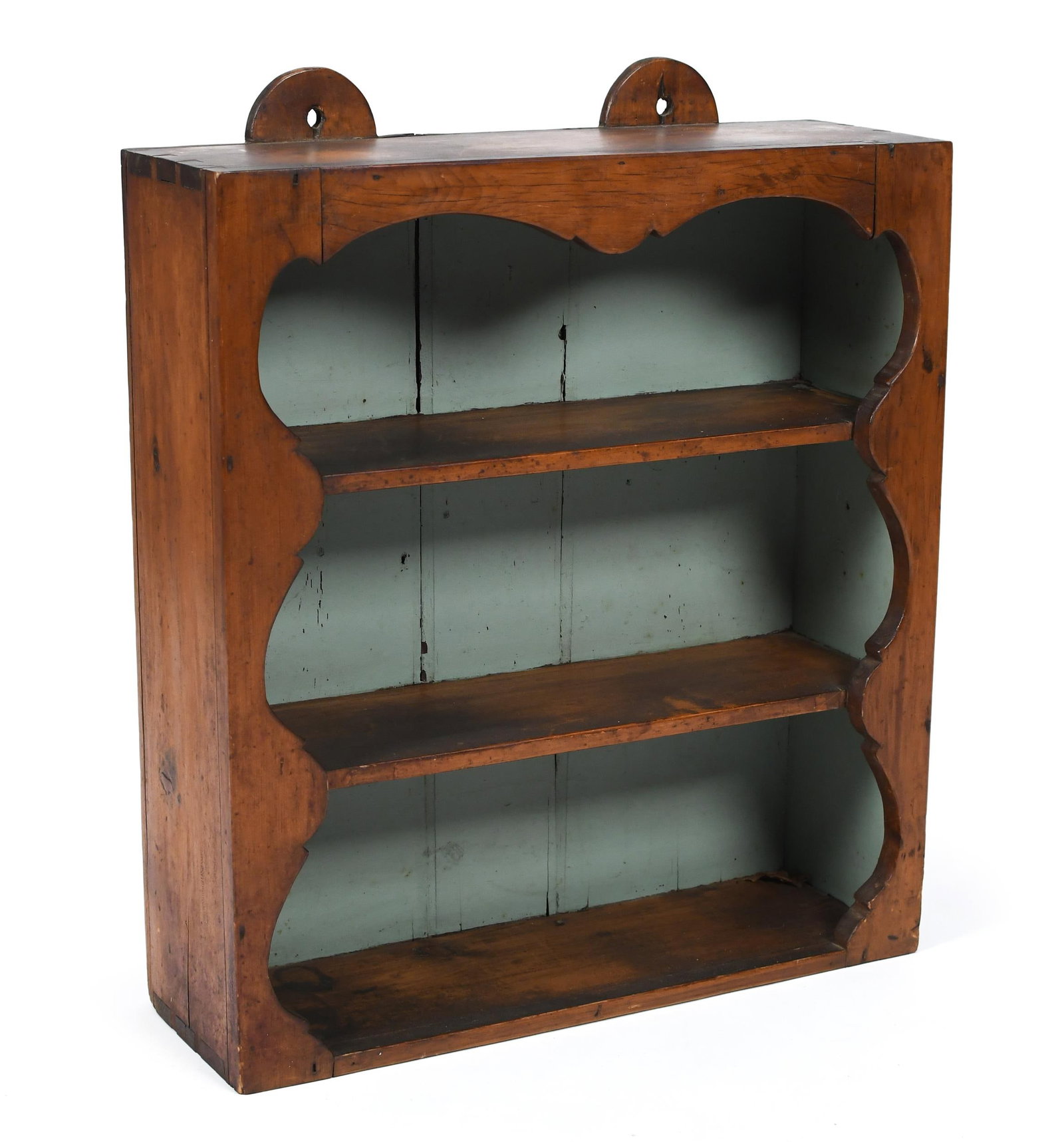 19TH C. CHERRY HANGING SHELVES.: Early 19th C. cherry hanging shelves, with a dovetailed case, scalloped side sides, two shelves and double tombstone back, 28.5“ x 24“ x 7.75“.