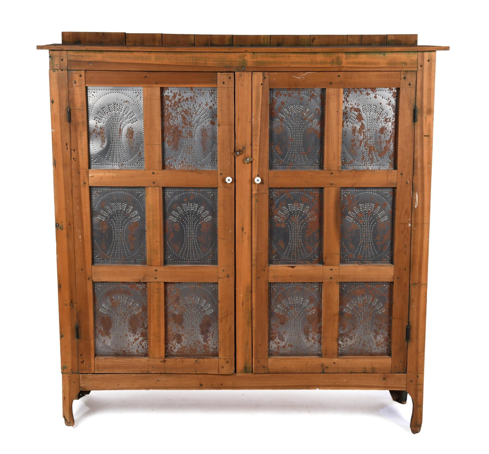 LG ANTIQUE POPLAR PIE SAFE WITH PUNCHED TIN PANELS.: A large 19th C. Poplar pie safe with two hinged doors, each with six Sheaf-of-Wheat punched leaf panels. 65.25” x 64.5W x 17.25”D.
