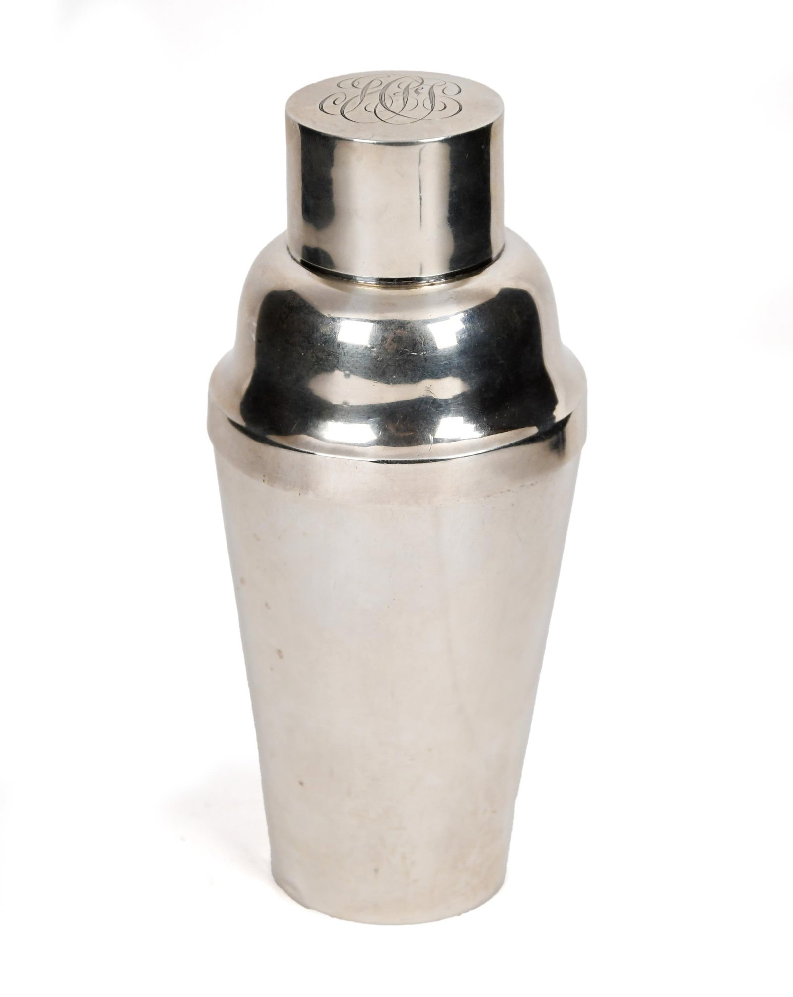 SHREVE, CRUMP, & LOW STERLING COCKTAIL SHAKER.: A ca. 1920 Shreve, Crump, & Low Co. sterling cocktail shaker with monogrammed cap, and Shreve Crump & Low Co Sterling mark on foot of tumbler with eagle. 8.05 oz t. 7.25”H.